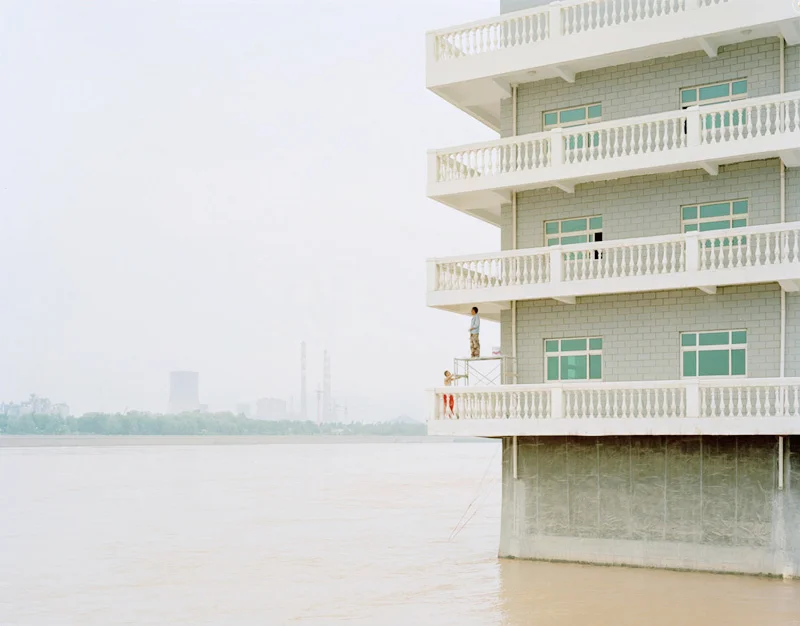 People Painting a House in the Middle of the River, Gansu, 2011