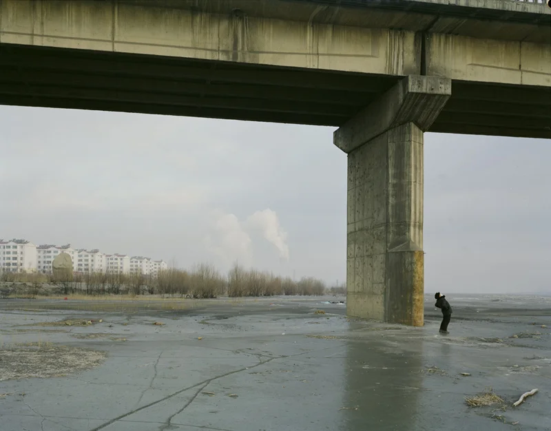 Man Doing Morning Exercise Under the Bridge with Mask, Ningxia, 2010