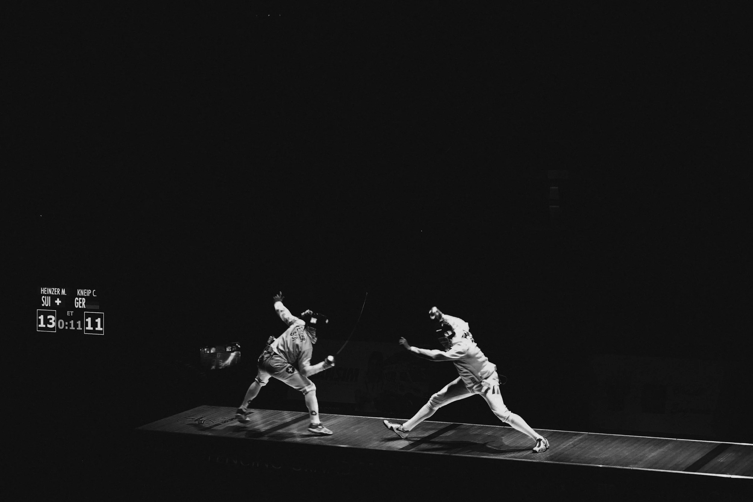 Two Fencers competing