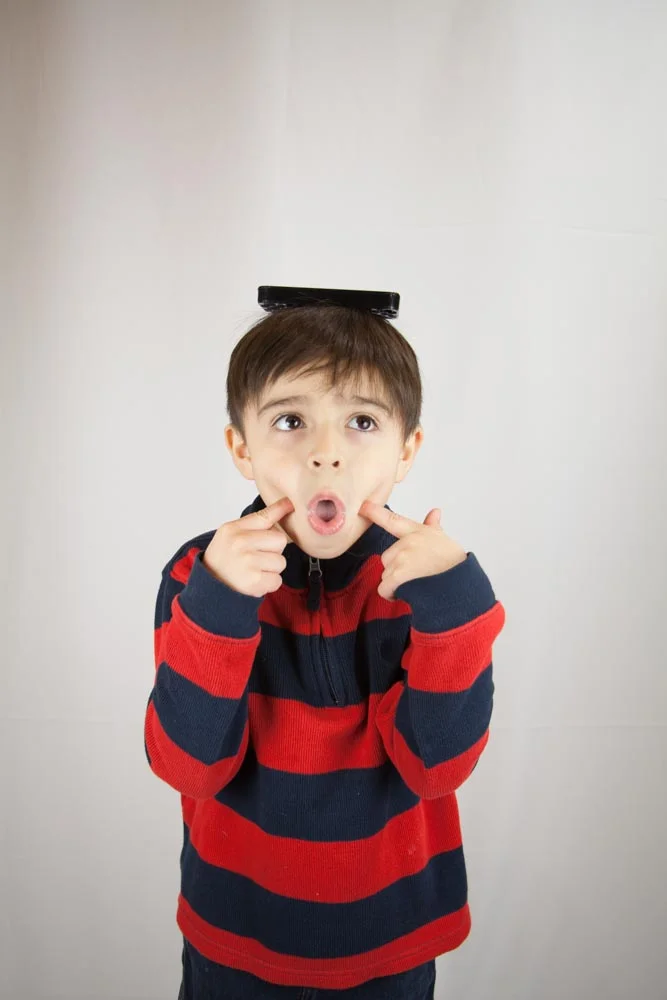 Connor tries on hats?