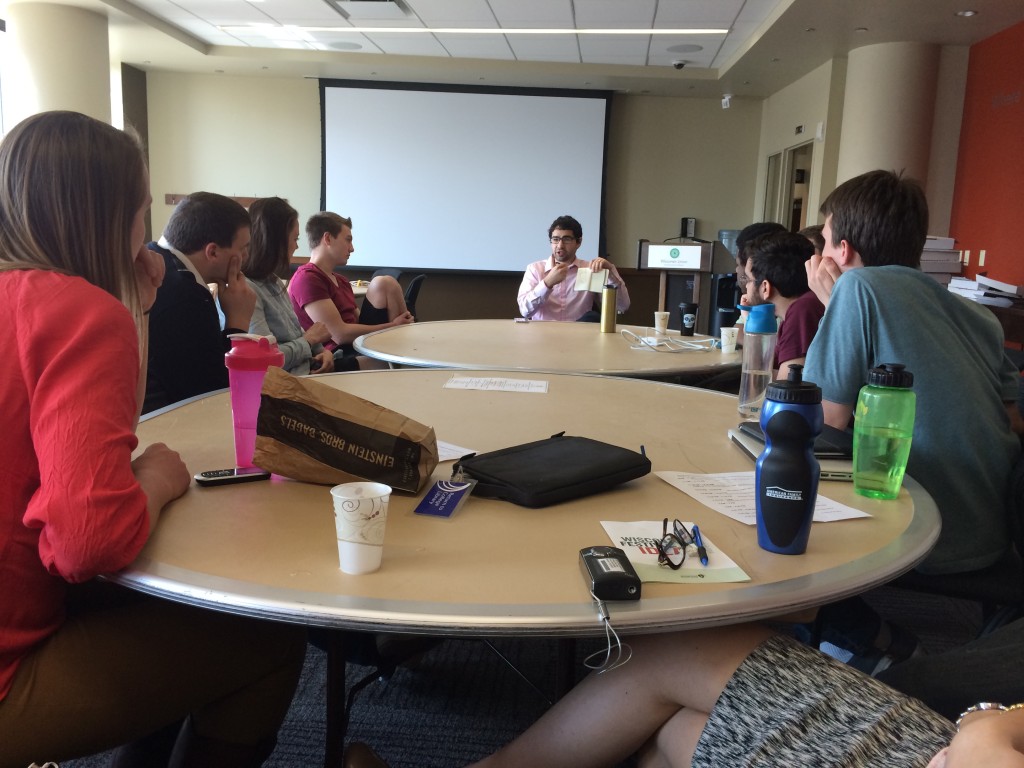 James Madison Fellow Alderman Scott Resnick talking to students about decreasing the digital divide in Madison.