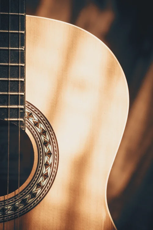 A close view of an acoustic guitar.
