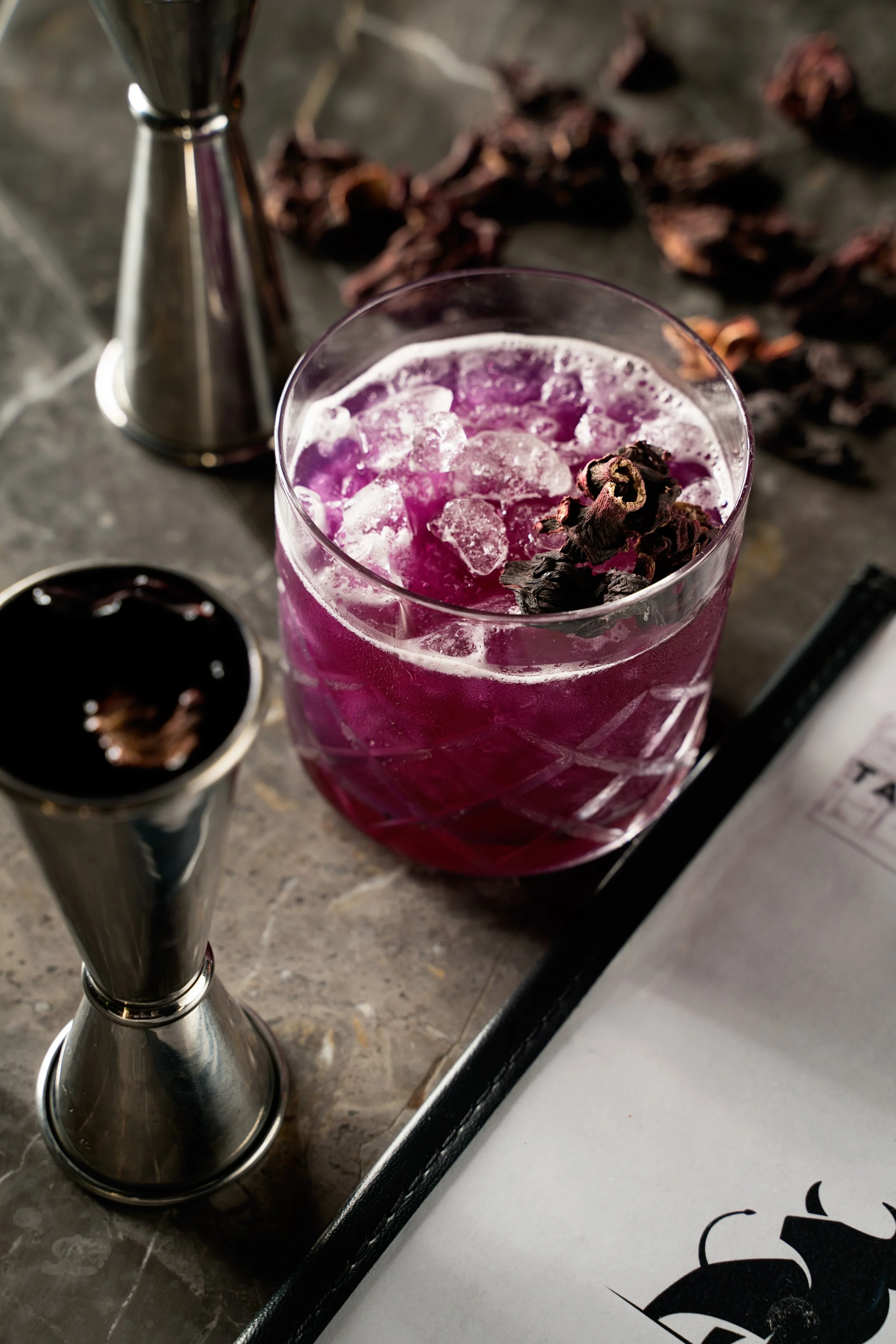 Dark blueberry cocktail with bull.