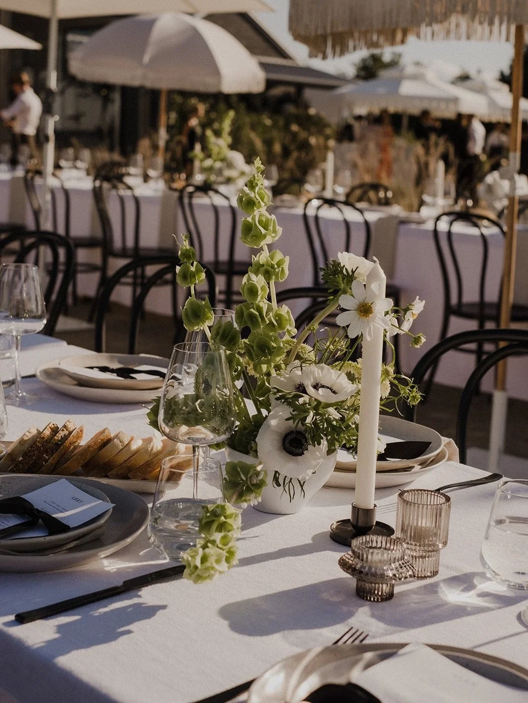 For Maddie and Touk&rsquo;s stunning day at The Orchard Estate, the goal was symbiosis. By pulling from a palette of neutral linens, stone-toned ceramics, and wild, airy florals, the tablescape feels like a natural extension of the hinterland. 

When