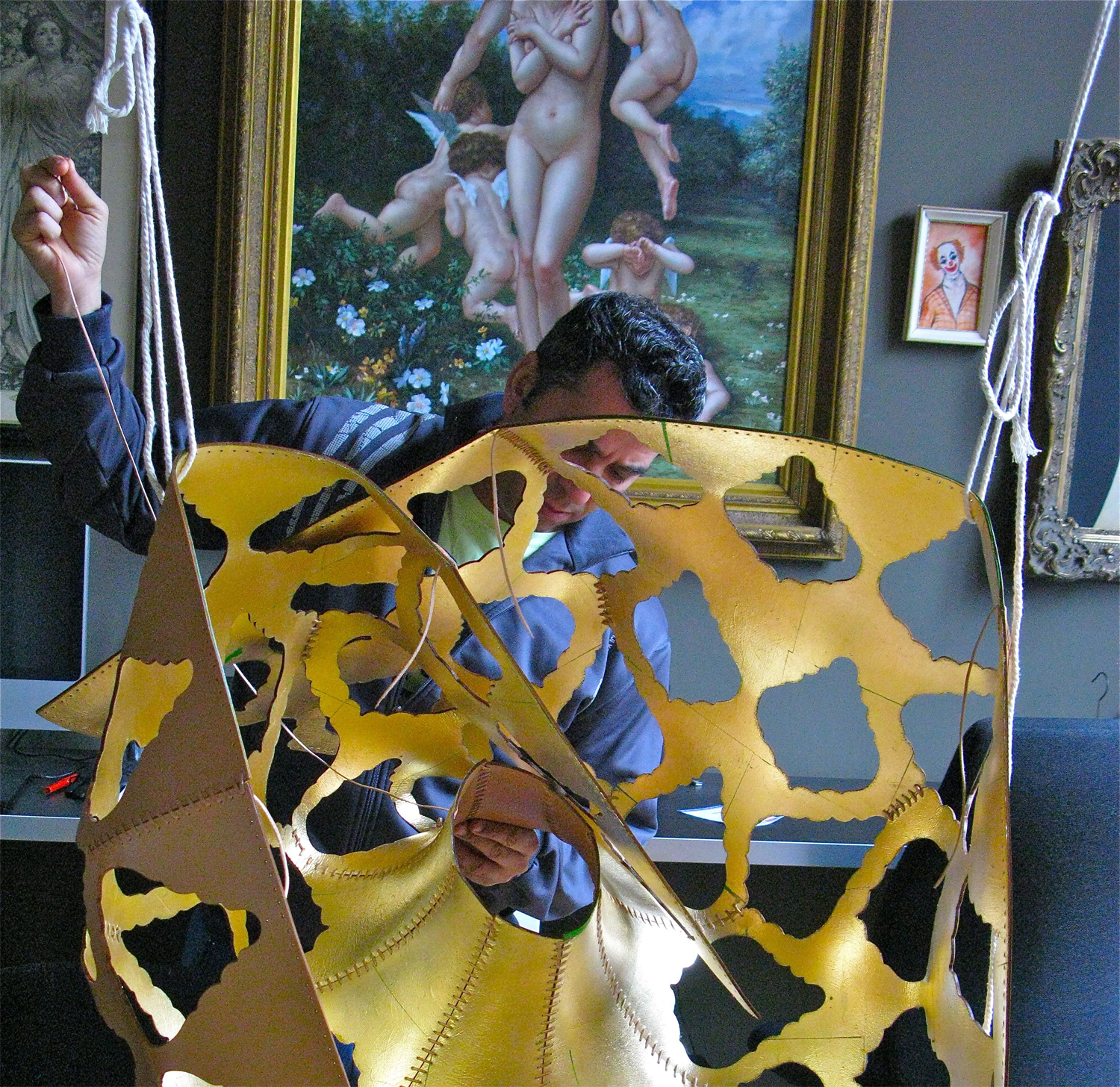 Hand sewing the Napoleon leather chandelier
