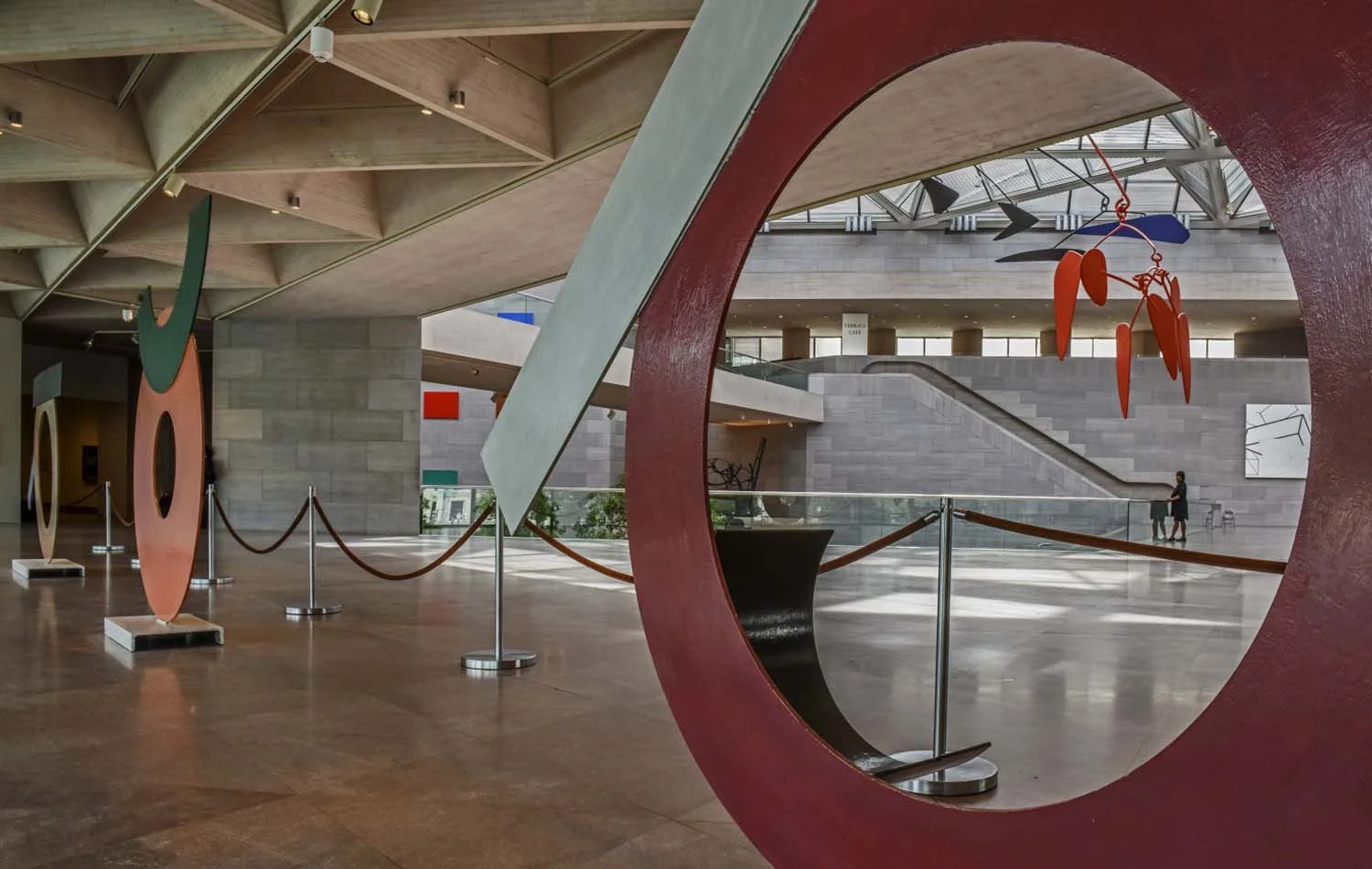 A trio of David Smith sculptures — Circle I, Circle III and Circle II — in the north window of the ground floor of the renovated museum. (Bill O'Leary/The Washington Post)