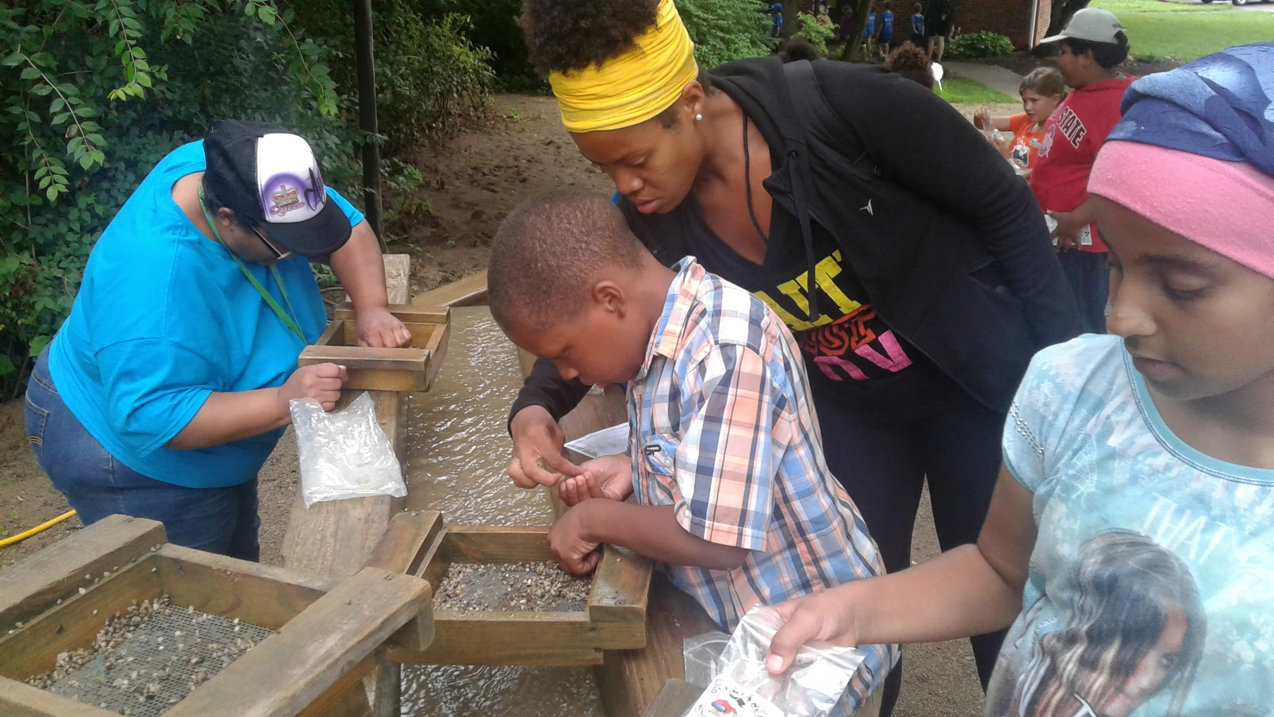 Elijah Woods, 9, center, of Trabue Crossing, goes mining at Olentangy Indian Caverns