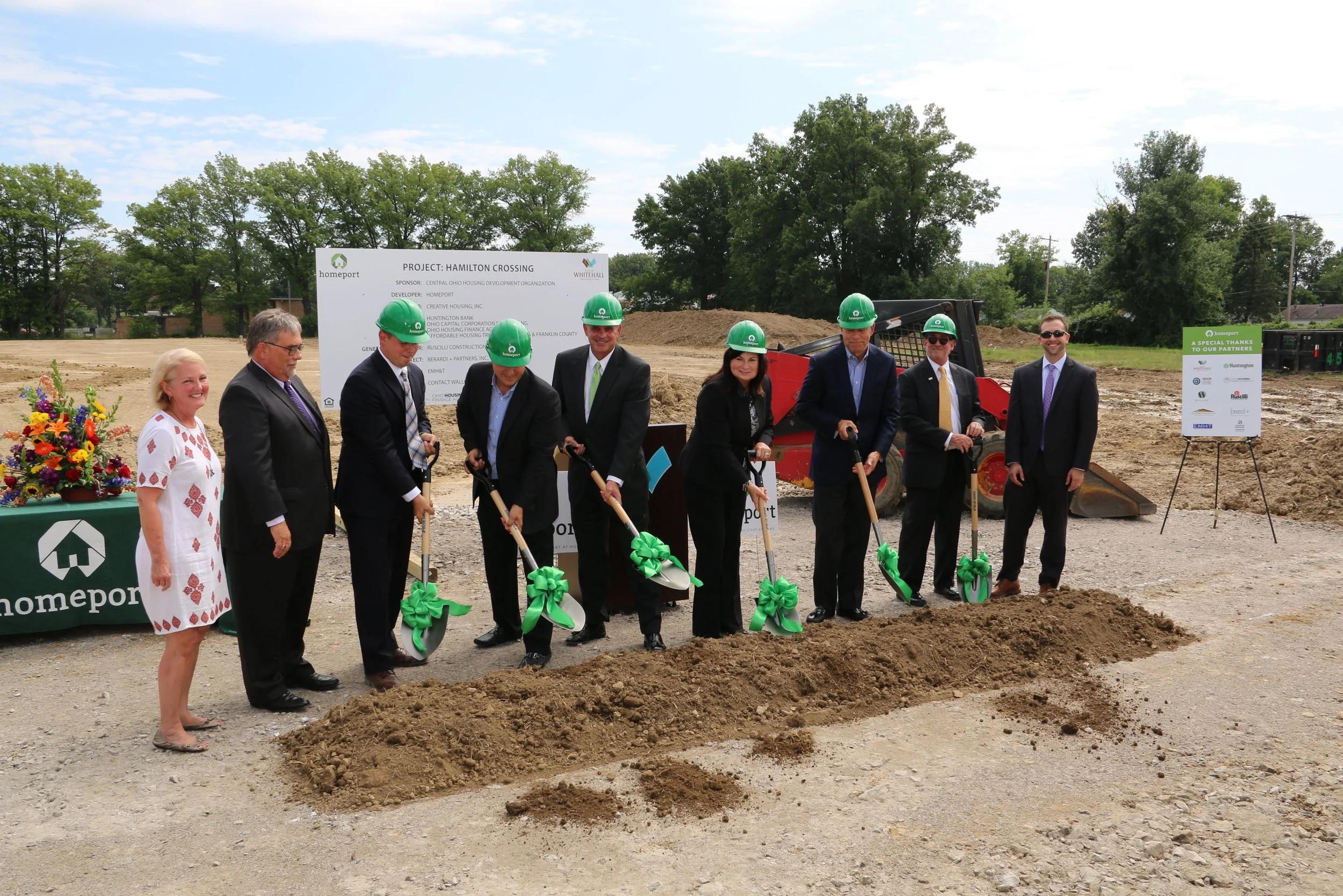 Hamilton Crossing groundbreaking participants left to right: Chris Hune, Homeport Board Chair; Doug Garver, Executive Director, Ohio Housing Finance Agency; Tom Feusse, CEO, Wallick Communities; Tony Ruscilli, President, Ruscilli Construction; Jim Kunk, President, Huntington Bank Central Ohio/Columbus Region; Whitehall Mayor Kim Maggard; Bruce Luecke, Interim President/CEO, Homeport; Hal Keller, President, Ohio Capital Corporation for Housing; Joseph Henry, Constituent Advocate, Office of U.S. Sen. Sherrod Brown.