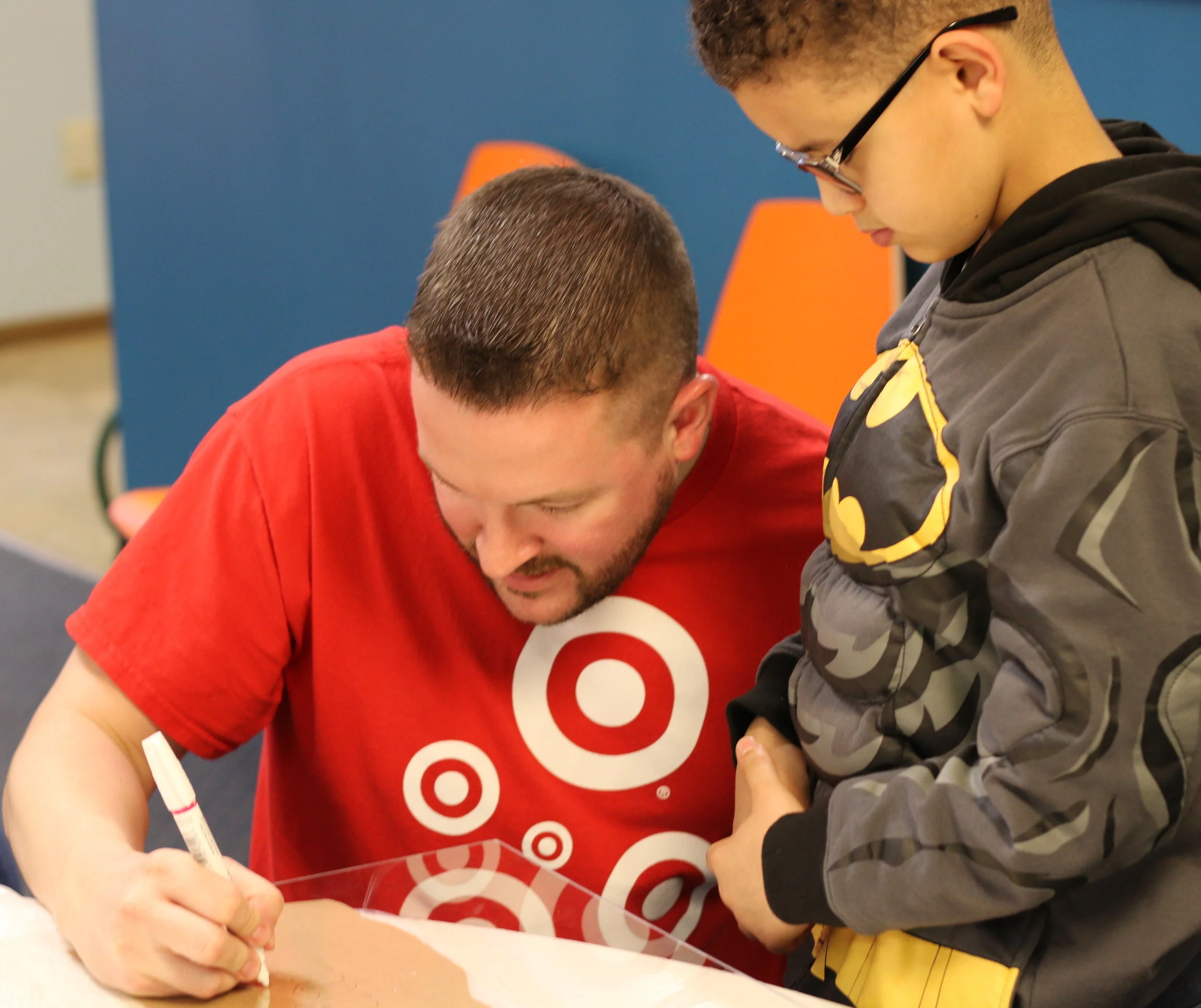 Target Store Team Leader Jeff Amos takes the lead on stenciling