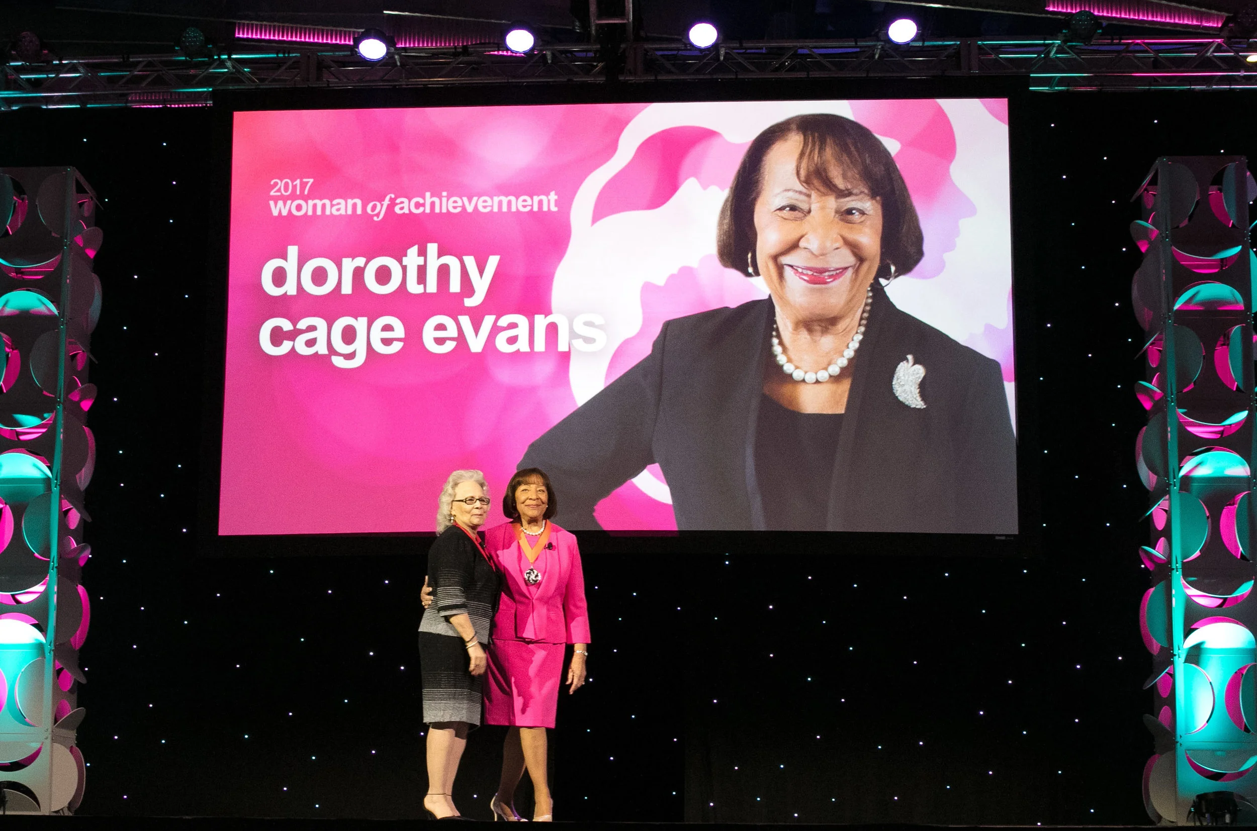 Dorothy Cage Evans on stage with previous YWCA Women of Achievement honoree Kathy Espy. 