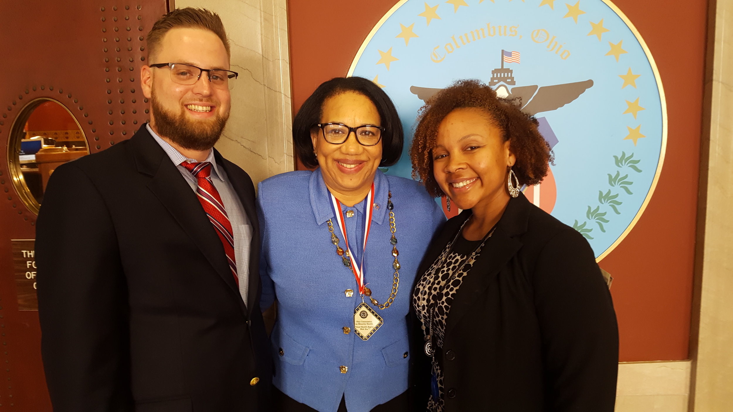Homeport's Lawrence Furst II, left, Columbus City Council President Pro-Tem Priscilla Tyson and Amber Jones of Columbus Public Health outside council chambers.
