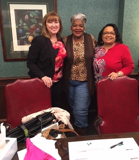 Framingham Village lease-option resident Linda Powell, center, at her home ownership closing flanked by Gail Blizzard, left, of Park National Bank, the lender, and Homeport's Brenda Moncrief, right.