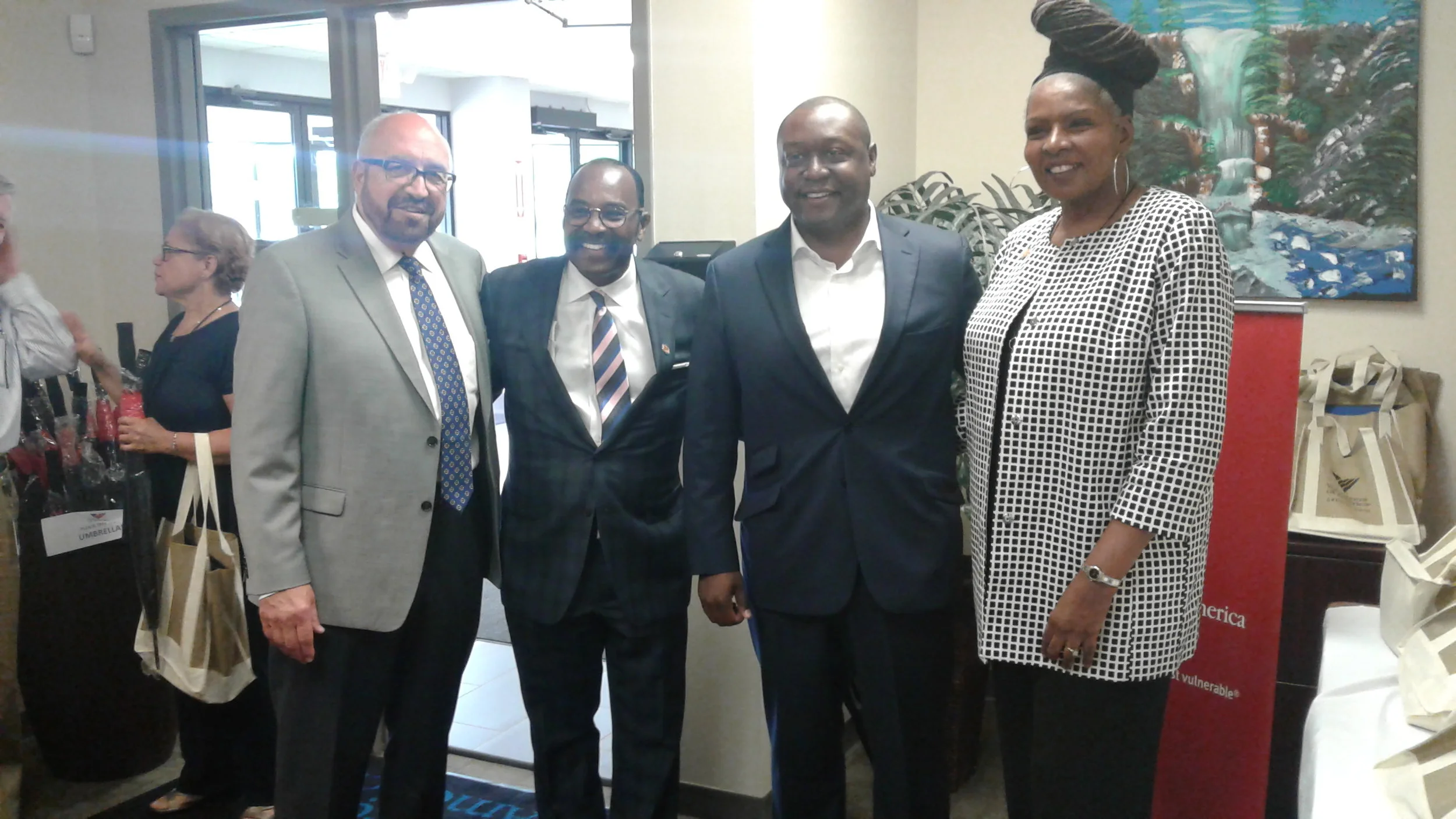Volunteers of America of Greater Ohio President Dennis J. Kresak greets State Rep. Hearcel Craig, Government Advantage Group Partner John Singleton and State Rep. Bernadine Kennedy Kent.