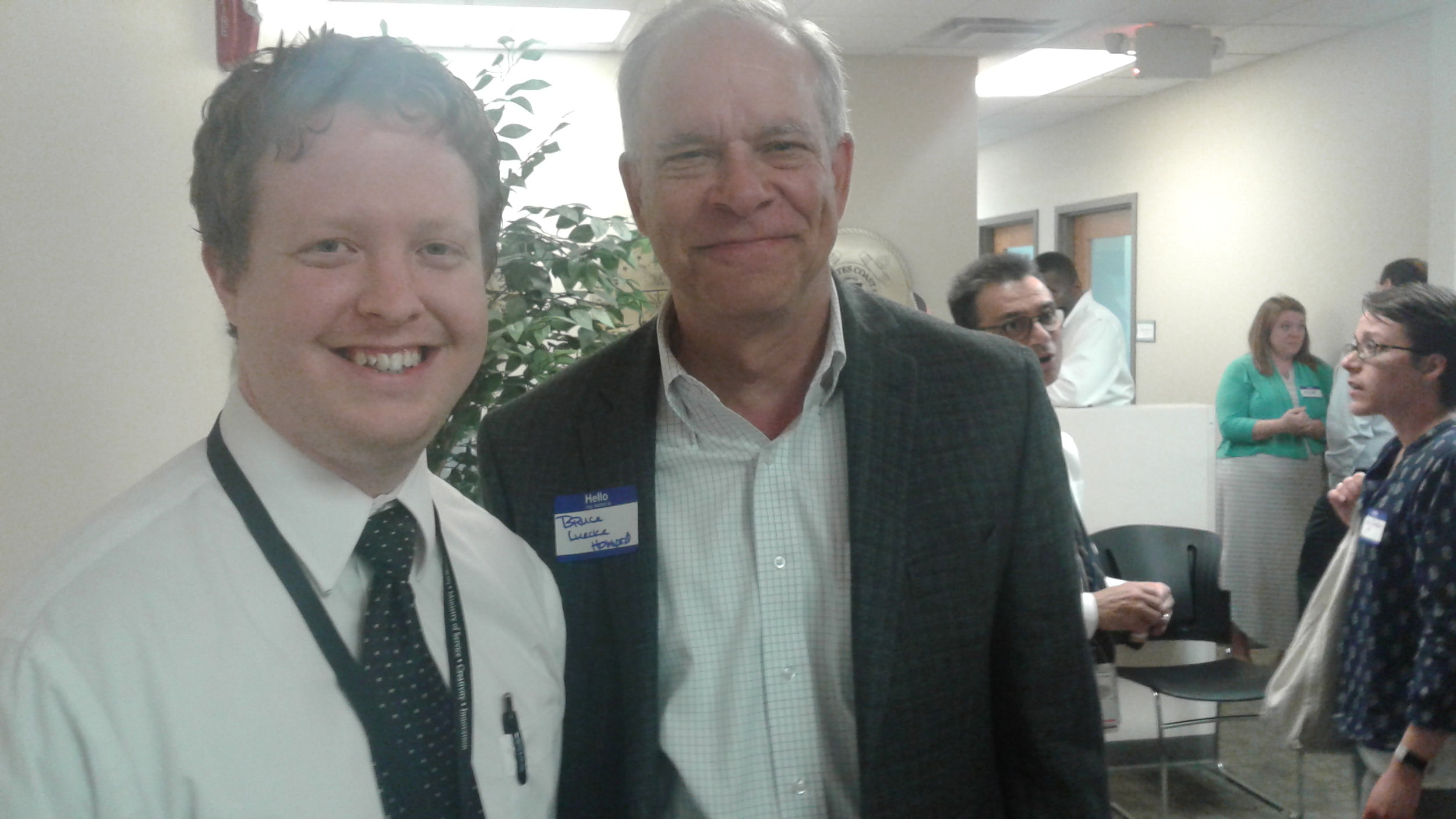 Veterans & Families First Supportive Services Manager Isaac Burton, left, greets Homeport President and CEO Bruce Luecke.