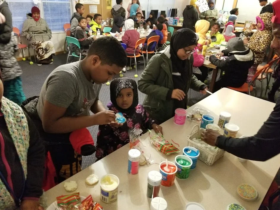One hundred residents of Emerald Glen participated in writing and arts activities including, above, decorating cookies.