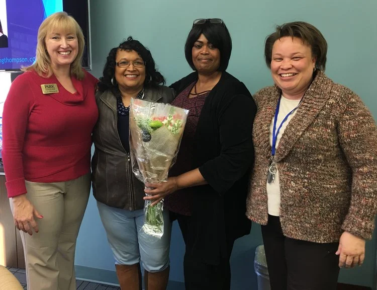 Greater Linden Homes resident Sherry White, second from right, at her closing in December.
