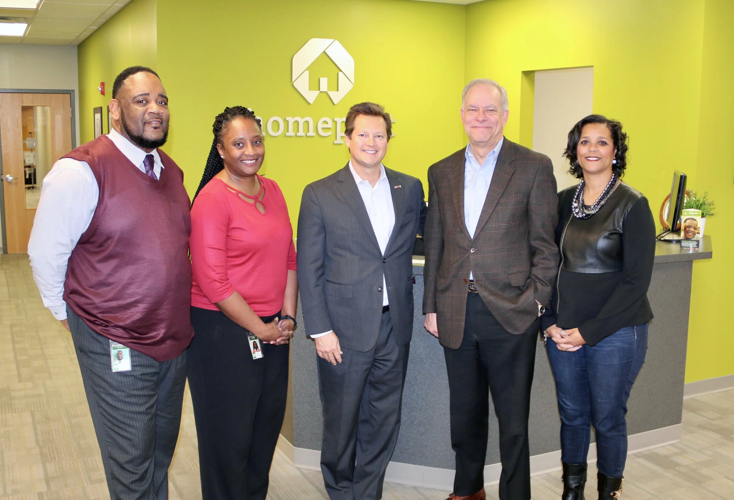 Steve Bennett, center, Central Ohio Market President of US Bank, stopped by Homeport headquarters to drop off a grant donation of $10,000 to support homebuyer education courses offered by Homeport. Accepting on behalf of Homeport were Kerrick Jackson, Netta Whitman, on the left, and Bruce Luecke and Laverne Price on the right. 