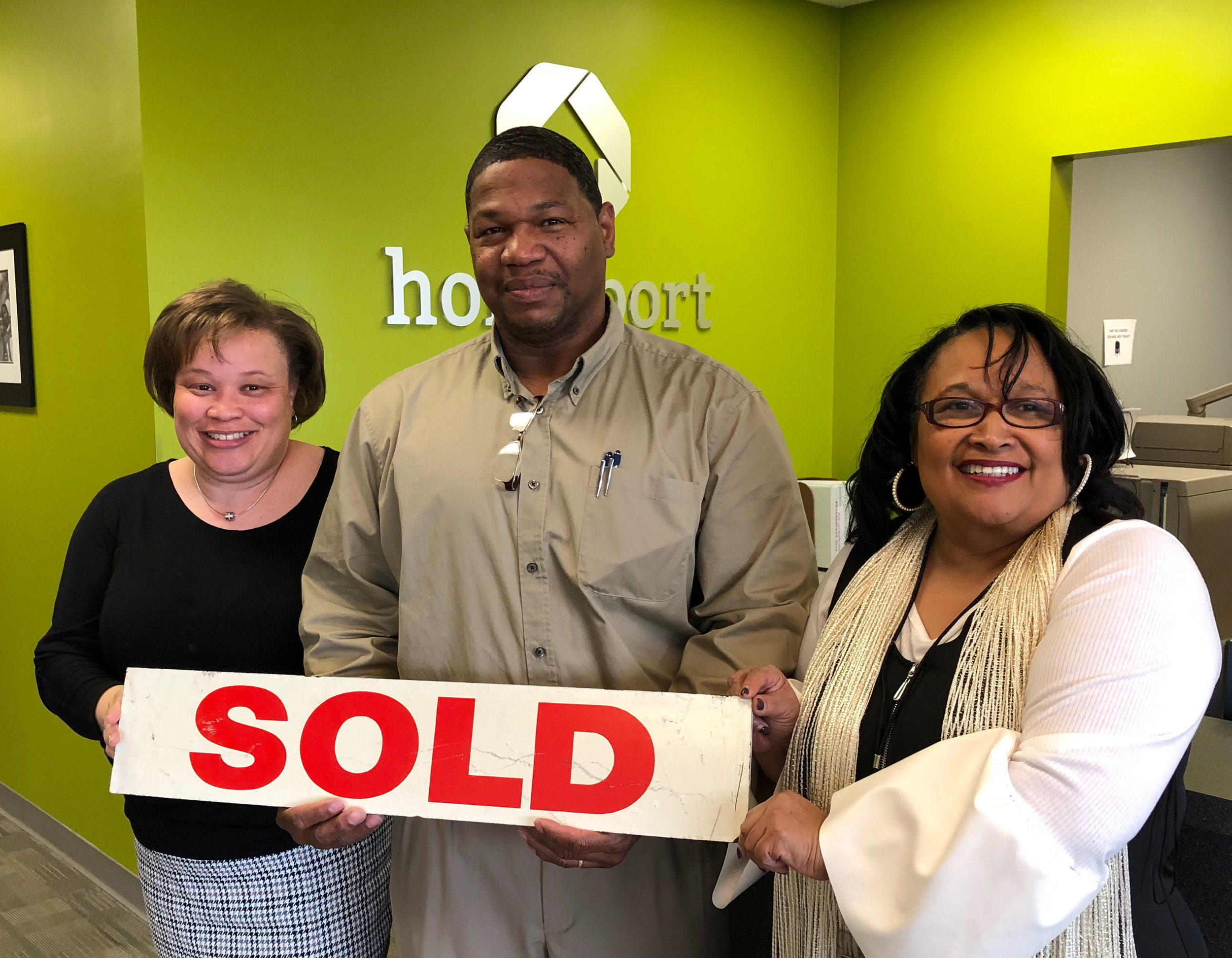 Barry celebrated purchasing his Greater Linden lease-option home this past week. To his right is Homeport's Brenda Moncrief, Lease Option Program Manager. To his left is real estate agent Melle Eldridge of King Thompson.