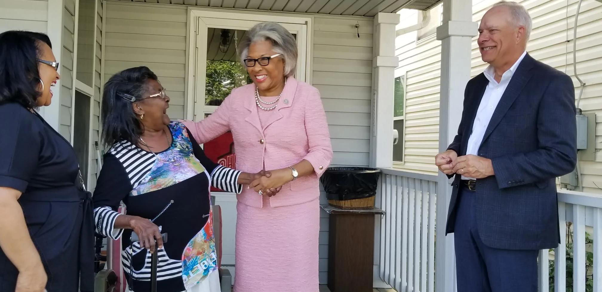 Rep. Joyce Beatty, second from right, congratulating Joyce Mayne.