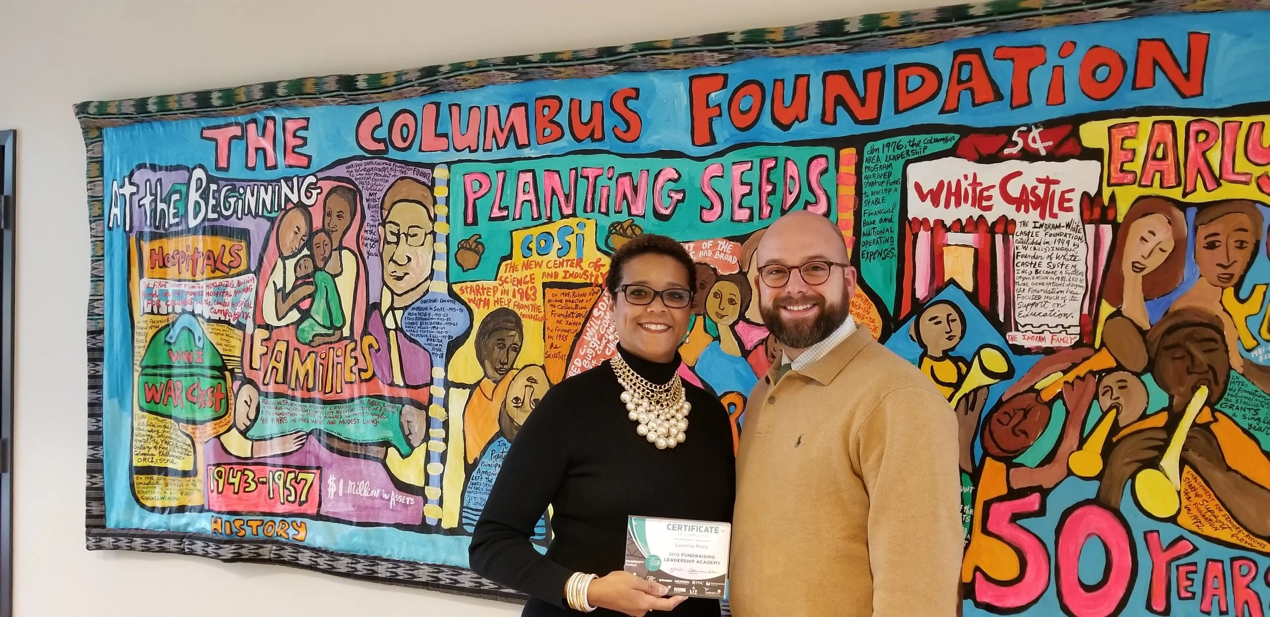 Homeport’s Laverne Price holds certificate for graduating fundraising academy. Joining her in photo is Columbus Foundation’s Dan Sharpe.