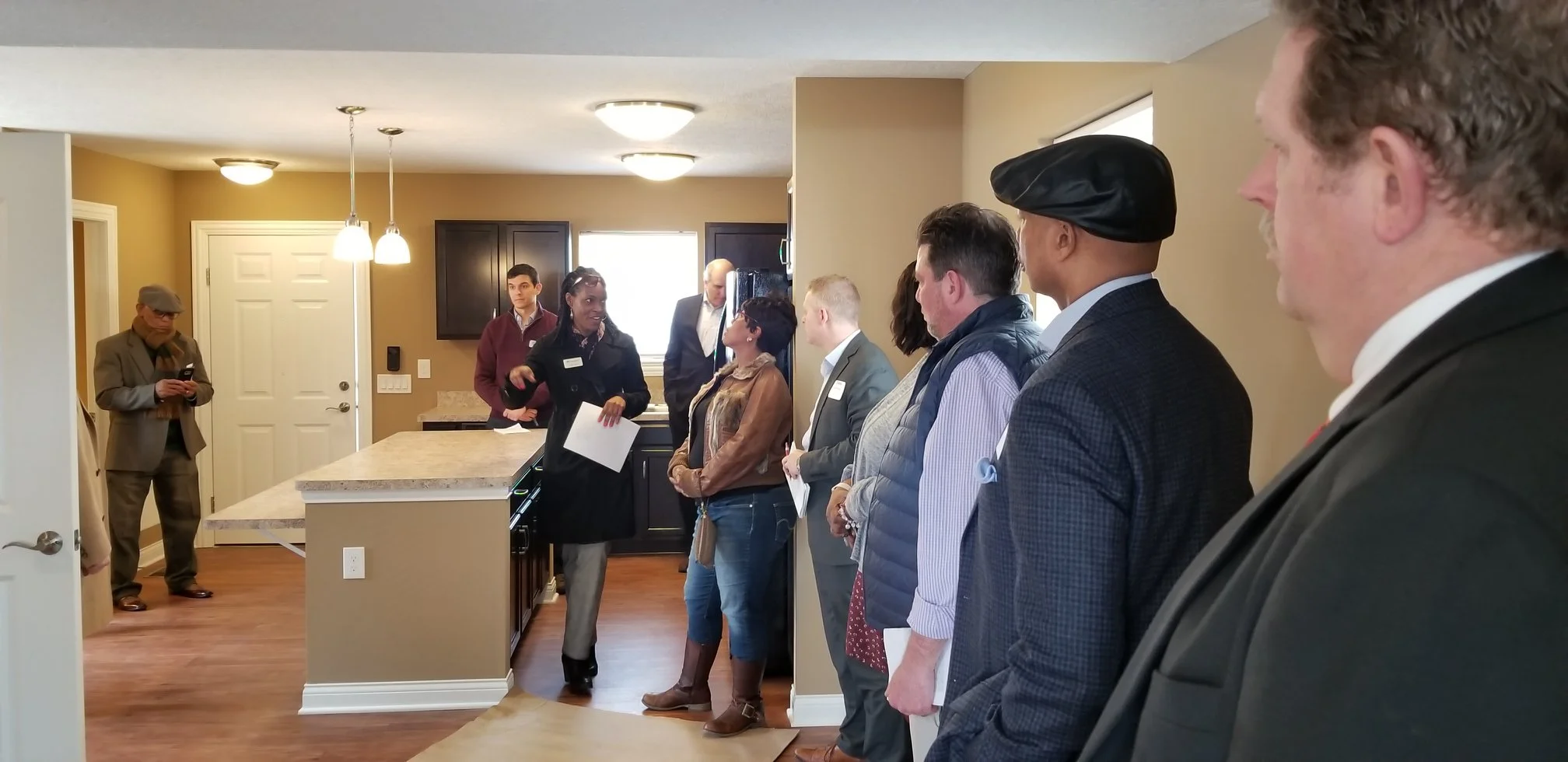 Homeport Sales Manager Angela Cradle explains the amenities of a new home in American Addition.