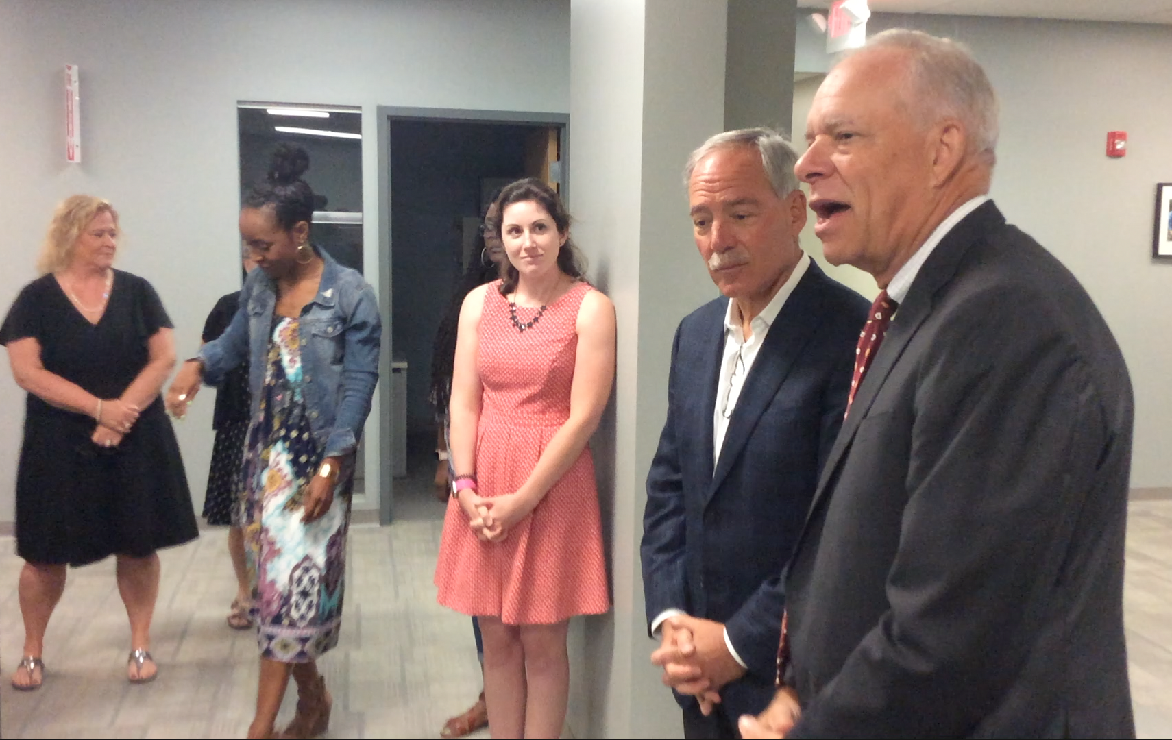 Homeport President & CEO Bruce Luecke, right, introduced Robert Schottenstein to Homeport staff.