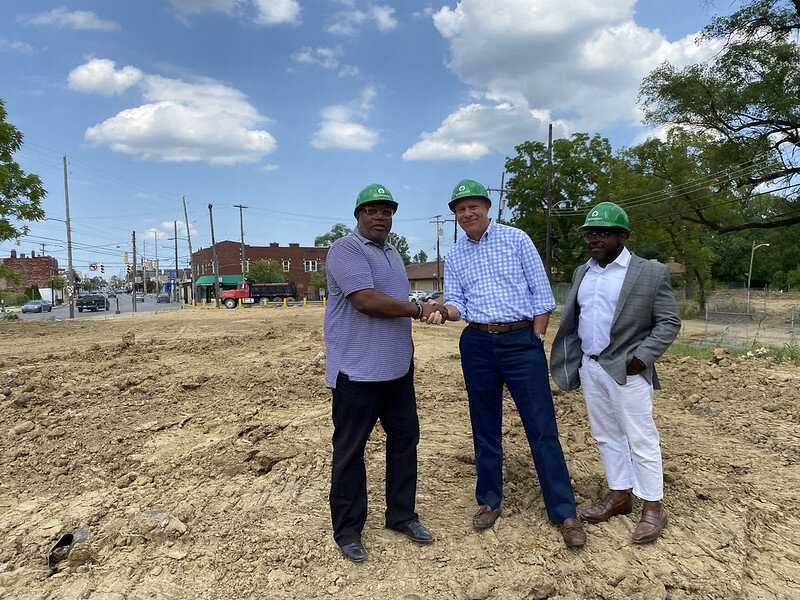 Bruce Luecke, center, shakes hands with Columbus Next Generation Executive Director Boyce Safford on the future site of Mulby Place in “Downtown Linden.” The $25 million, 100-unit affordable apartment development for seniors at Cleveland and Myrtle avenues represents the largest financial investment by Homeport in several years. Land clearing and construction is expected to begin this fall. Homeport Project Manager Tuhru Derden is on right.
