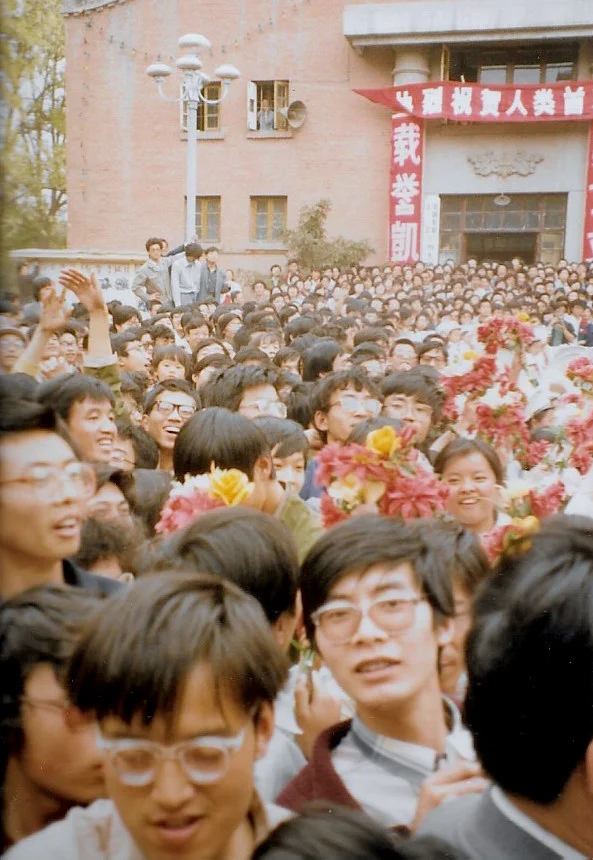 Students at Lanzhou University in Lanzhou China greet the Trans-Antarctica team as they get off the bus. Photo: Cathy de Moll