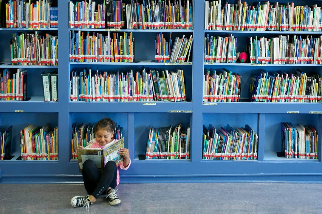 Girl reading in library.jpg
