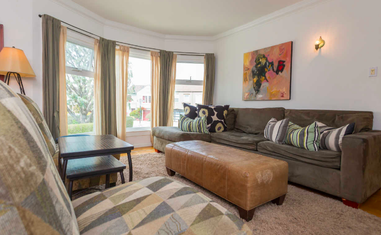 Built in 1940, this multi-level home features 4 bedrooms, 2 bathrooms and over 1,800 square feet of living space. Recently renovated, featuring natural-light throughout, wood flooring, crown molding and a center patio. Close to transportation with easy access to highways for commuting. The top level features a formal living room with fireplace and bay windows, dining room, and a light, airy kitchen. A center patio elegantly divides the floor, and fills the space with additional natural light. Two spacious bedrooms overlook the backyard with panoramic views of the city, and a full bathroom features a large sky light. The middle level includes an additional living room - great for movie night, one bedroom and a full bath, laundry room, and a one-car garage. The lower level offers an additional bedroom or bonus room, large walk-in closet, and additional storage area. The spacious backyard is perfect for a large garden, entertaining space, and play area. Click here for more. To view this home call Emily: 415.730.9759 .