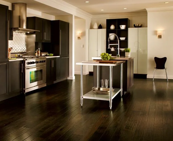 Dark hardwood works here because it contrasts with the white walls and cabinetry, from Armstrong Flooring