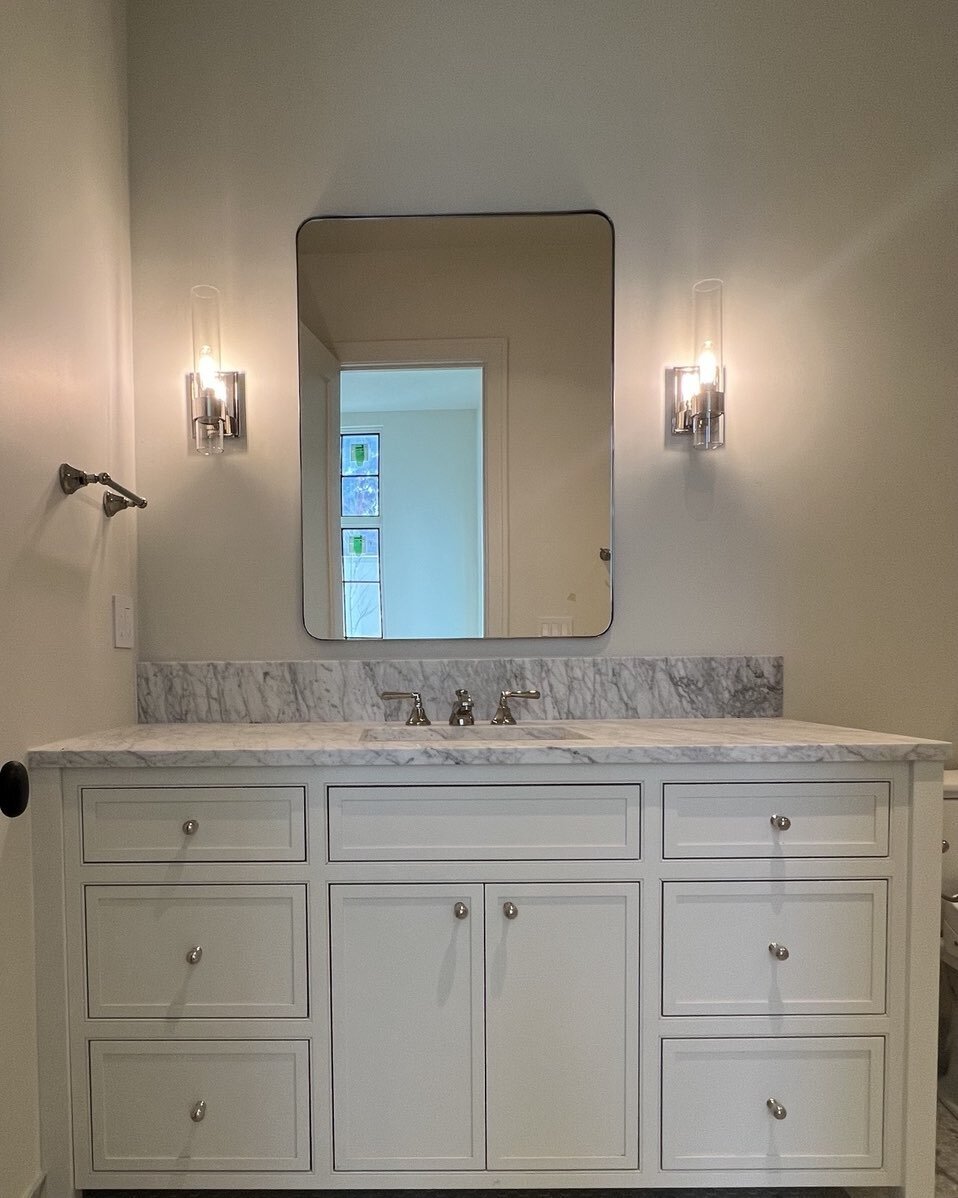 Loving this super soft bathroom with off white cabinet, polished nickel finishes and Carrara marble floor.