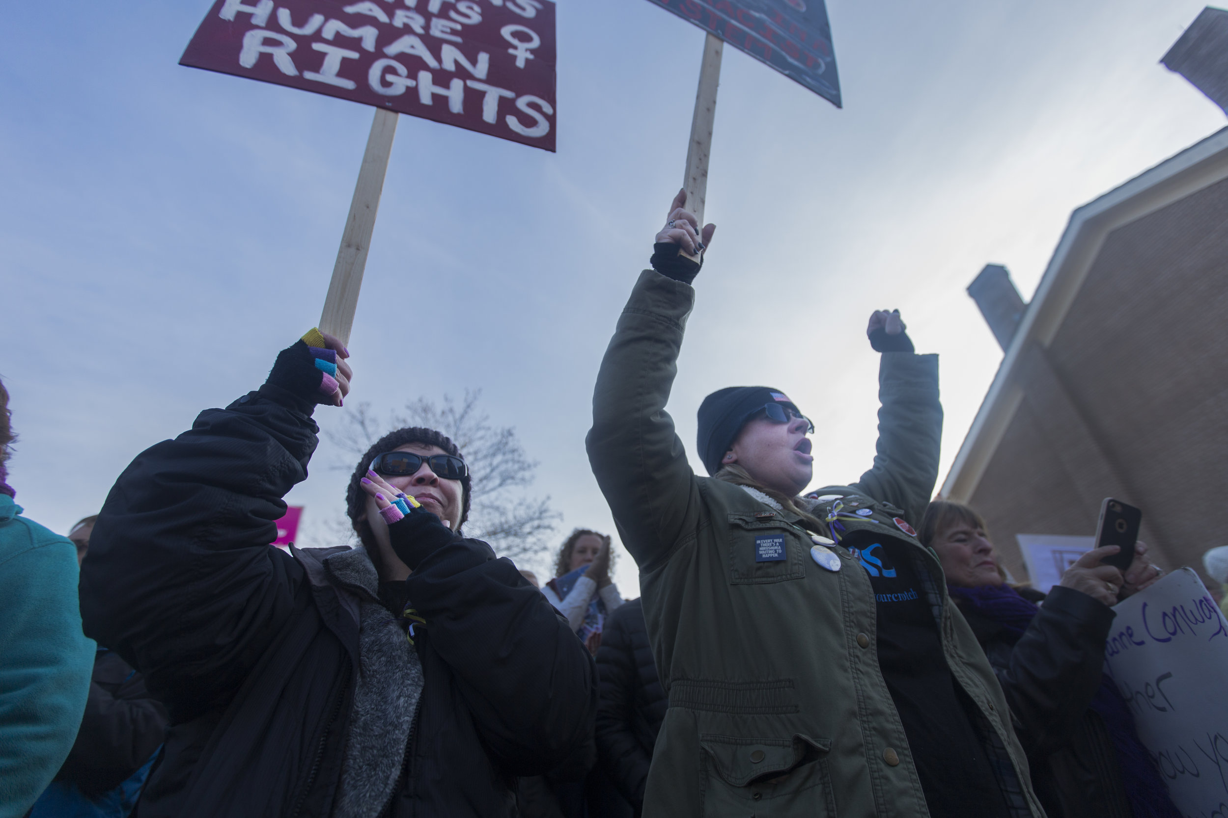  Sue Kbrenernpaplassn (left) and Darcy Hill (right) from Anchorage, AK hold up their signs at the Women March held at the Women's Rights National Historical Park in Seneca Falls, N.Y on Jan. 21, 2017. "We traveled across the country to stand in solid