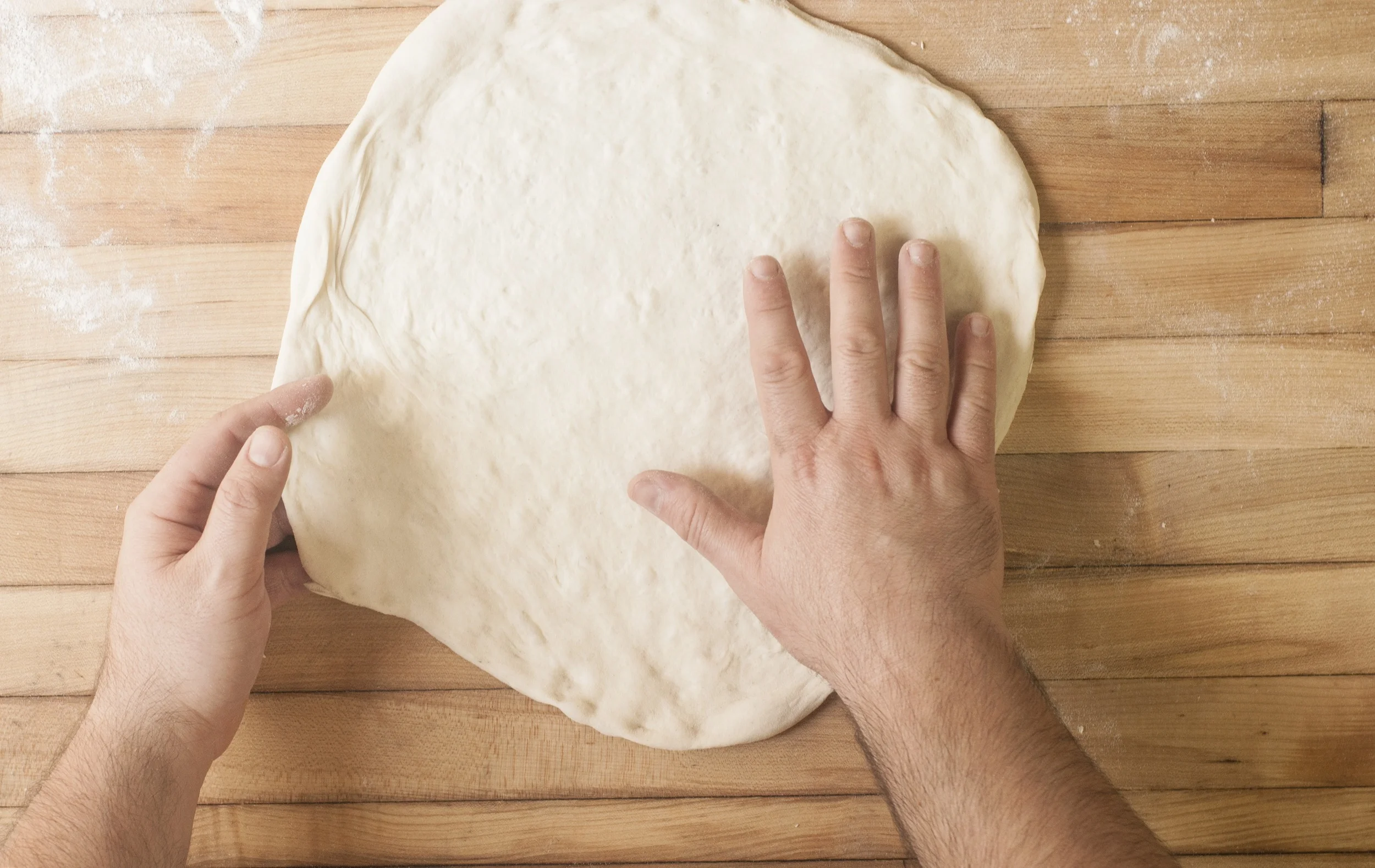 Pizzeria Sapori shaping dough.jpg