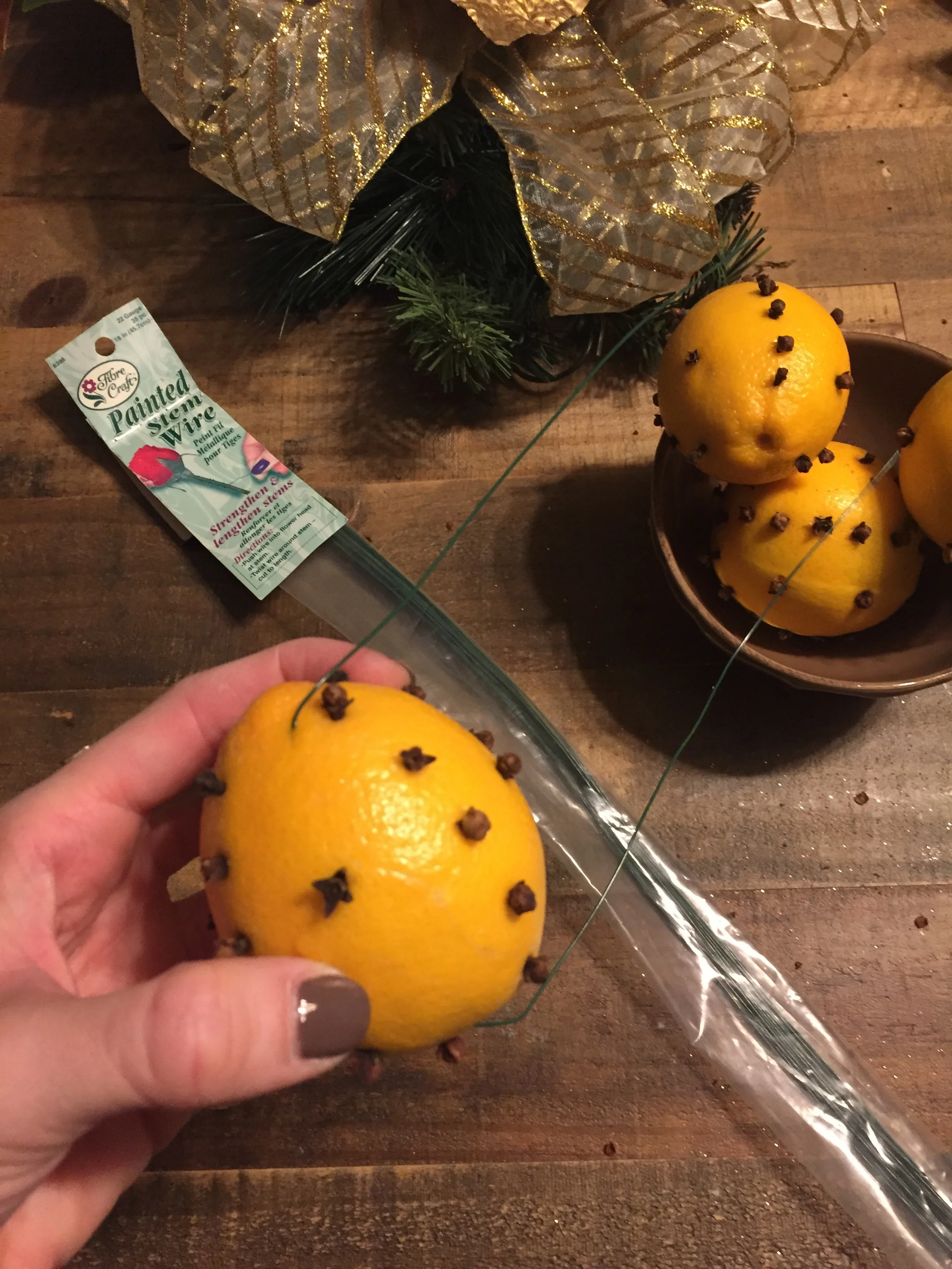 I used floral wire to attach each orange to the arrangement.