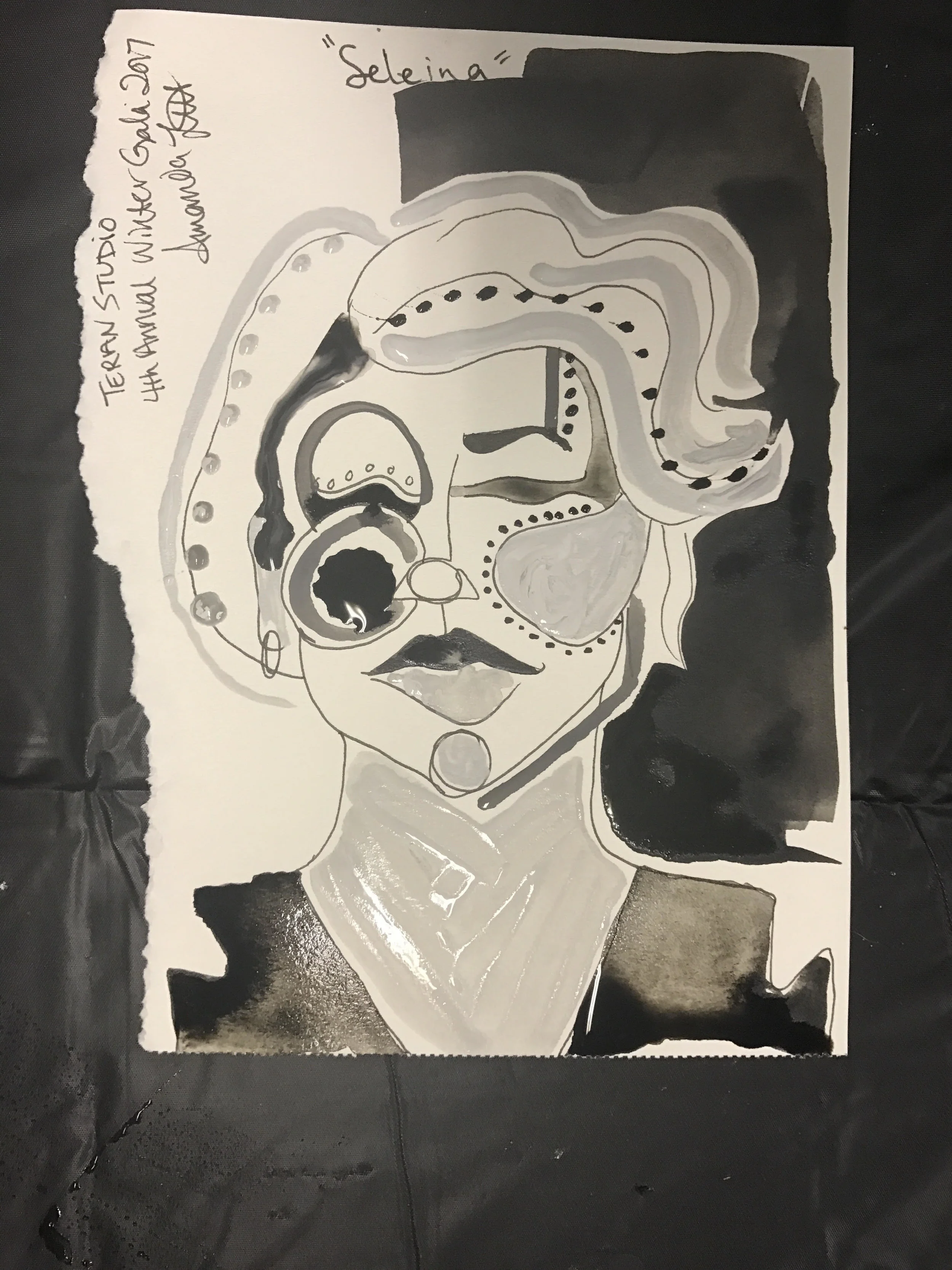 "Seleina" Seleina is an aesthetician pursuing her massage therapy license. She discovered Teran Studio via graffiti and fine artist FaceofMarky. As I was going to dip my brush in water, a single black drop landed in the circle of her left cheek. Seleina said "It was meant to be".