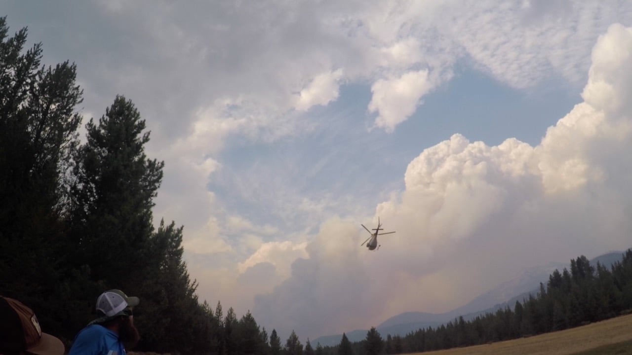 Our team watches as another group gets the first helicopter evacuation. - Photo: Luke Kantola