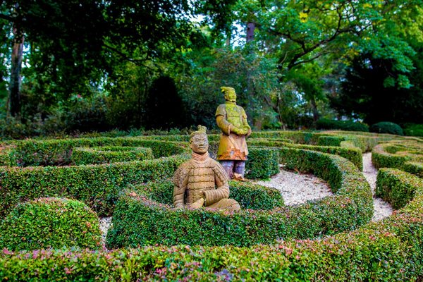 Asian terra cotta warrior statues grace the sculpted rear garden at the home of Tahamtan Ahmadi and Parisa Abdollahi in Rydal, Pennsylvania. (JEFF FUSCO / For the Philadelphia Inquirer)