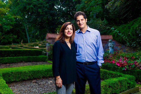 Tahamtan Ahmadi and Parisa Abdollahi in their backyard sculpted garden in Rydal, Pennsylvania. (JEFF FUSCO / For the Philadelphia Inquirer)