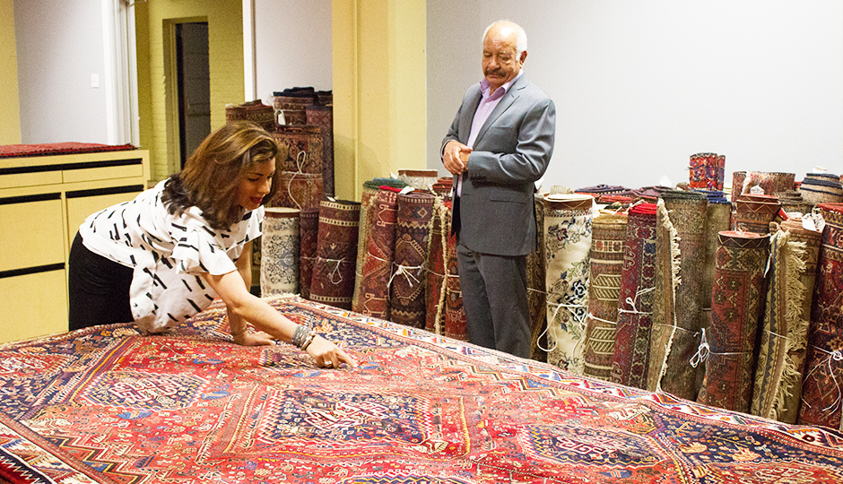 Parisa points out asymmetrical details in a rug. | Photo by Lauren McGrath for phillymag.com.