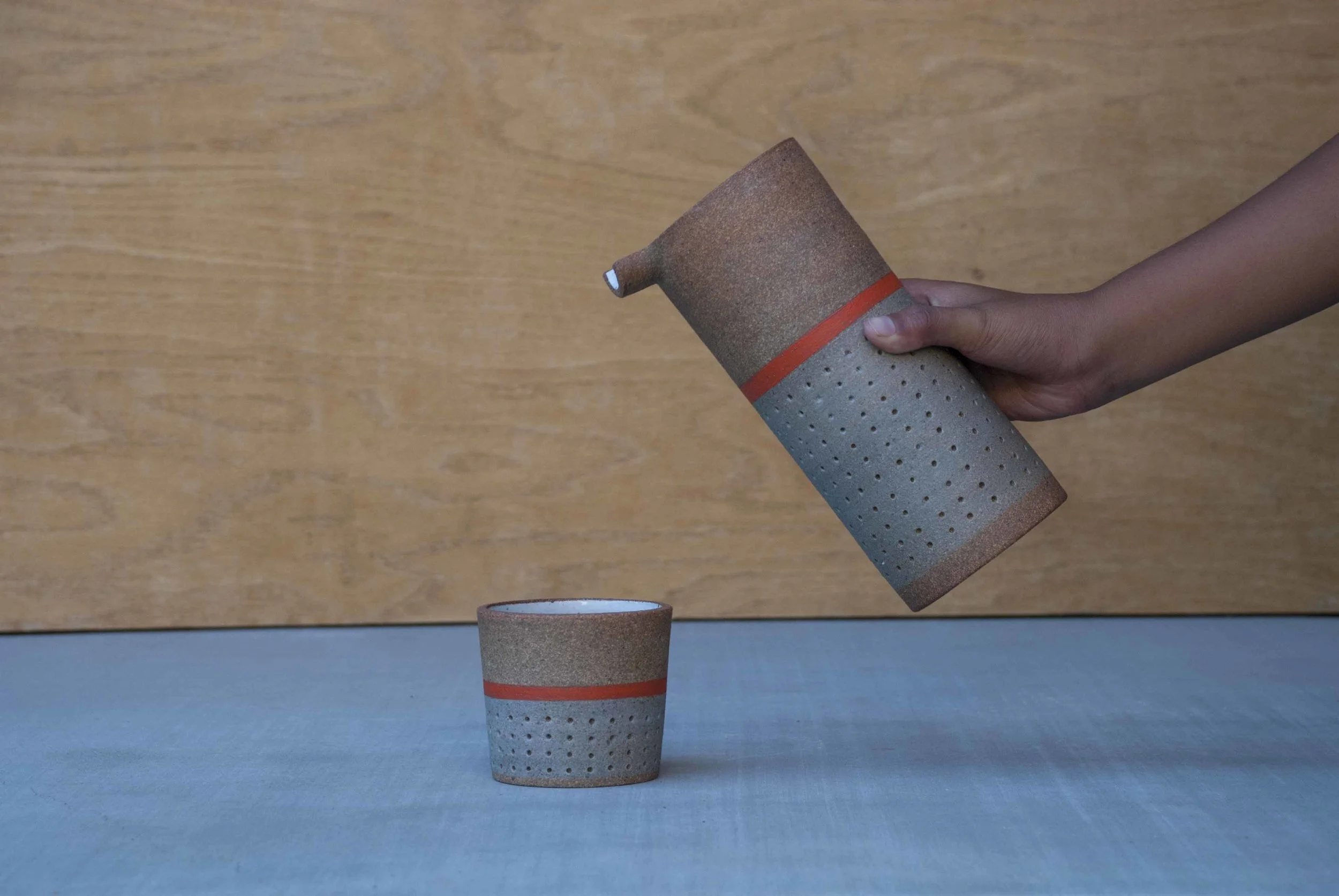 gray dot pitcher and cup with hand.JPG