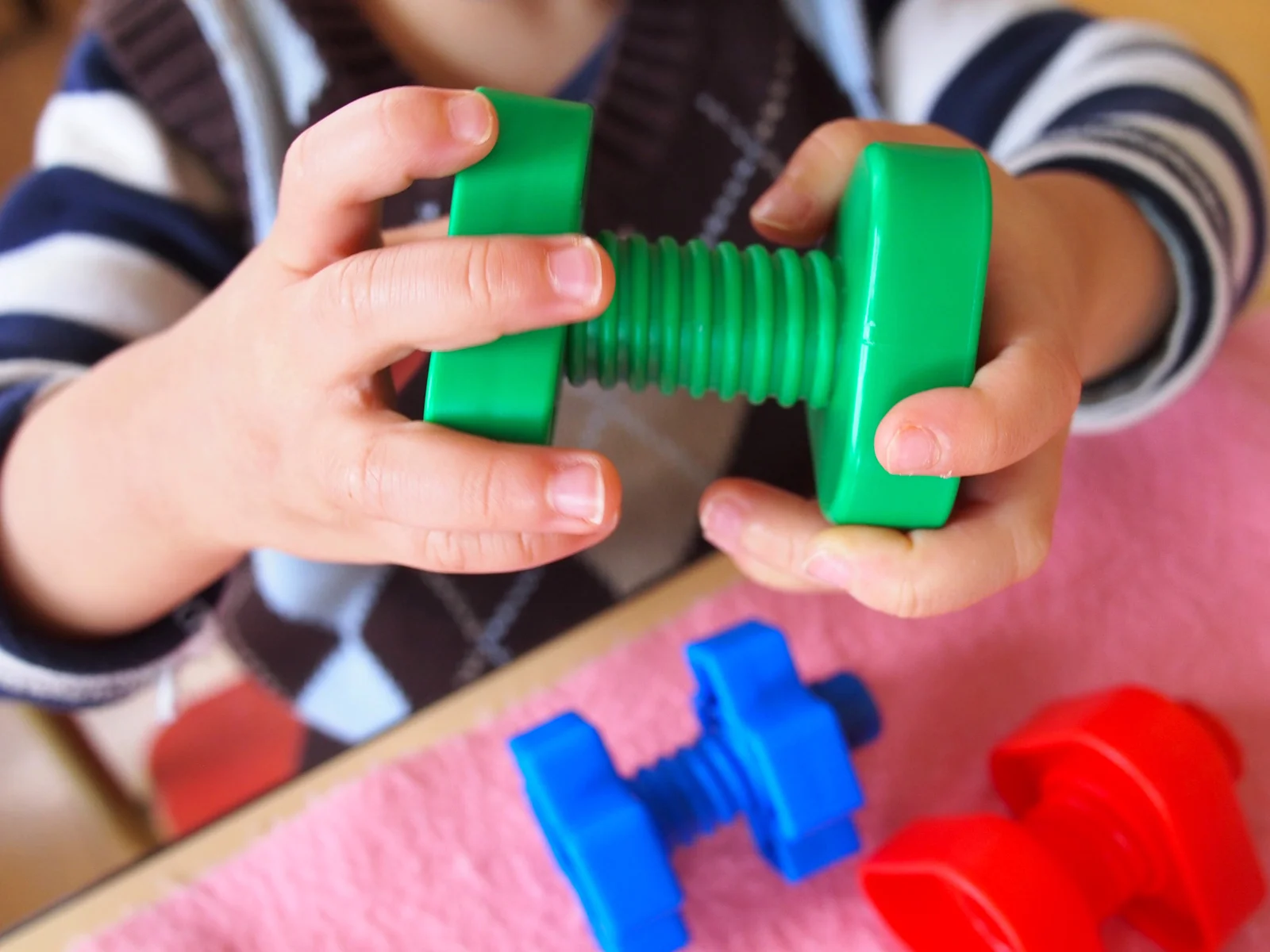 Hand-eye coordination and motor skills are a main focus at this level.