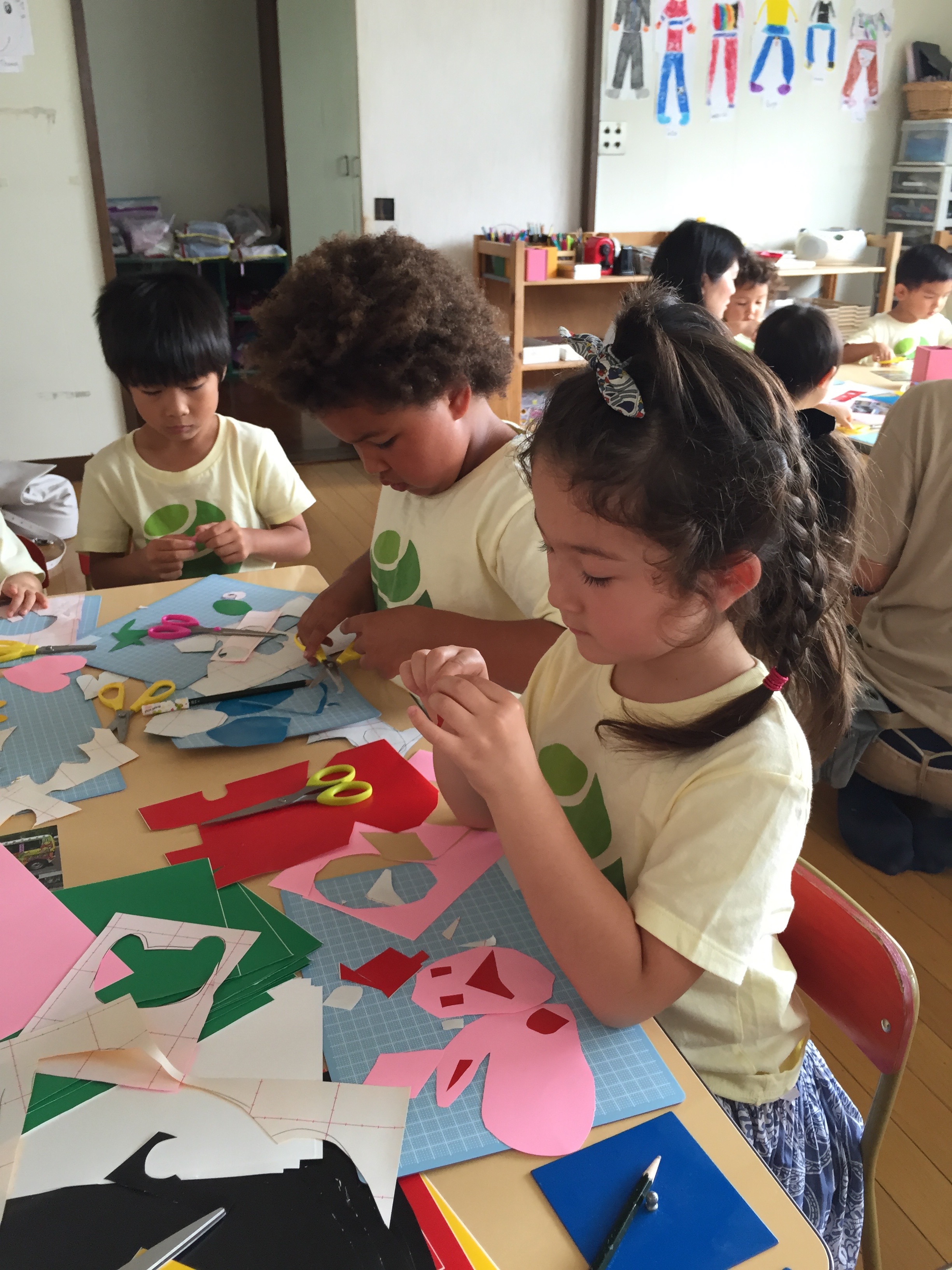 Following Mr. Rocco's instruction, children from the Bluebird class start cutting.