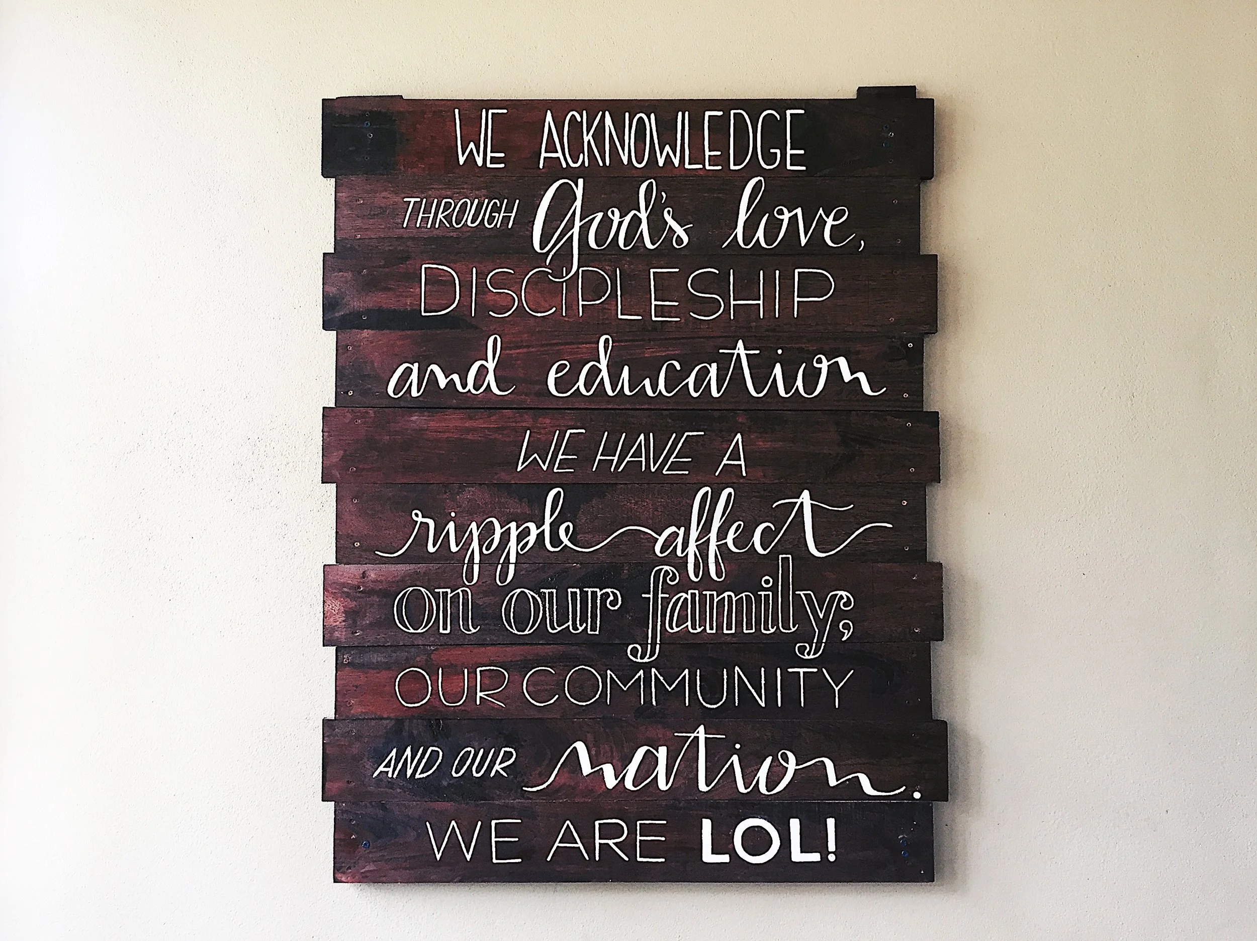 Hand painted mission statement for L.O.L. Children's Home in Southern Belize.
