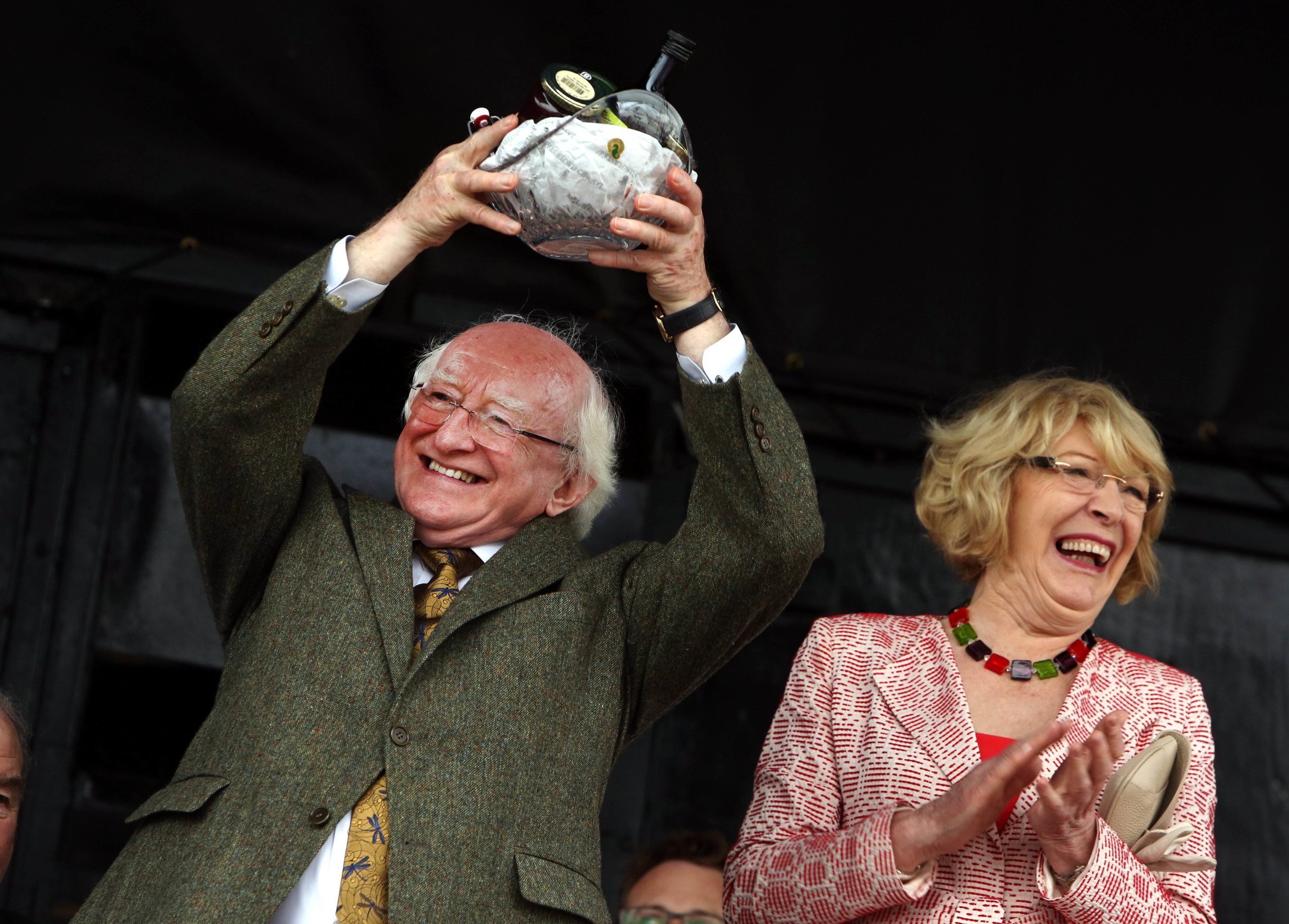  President Michael D Higgins with his wife Sabina, on receiving a gift at the ploughing championships    
