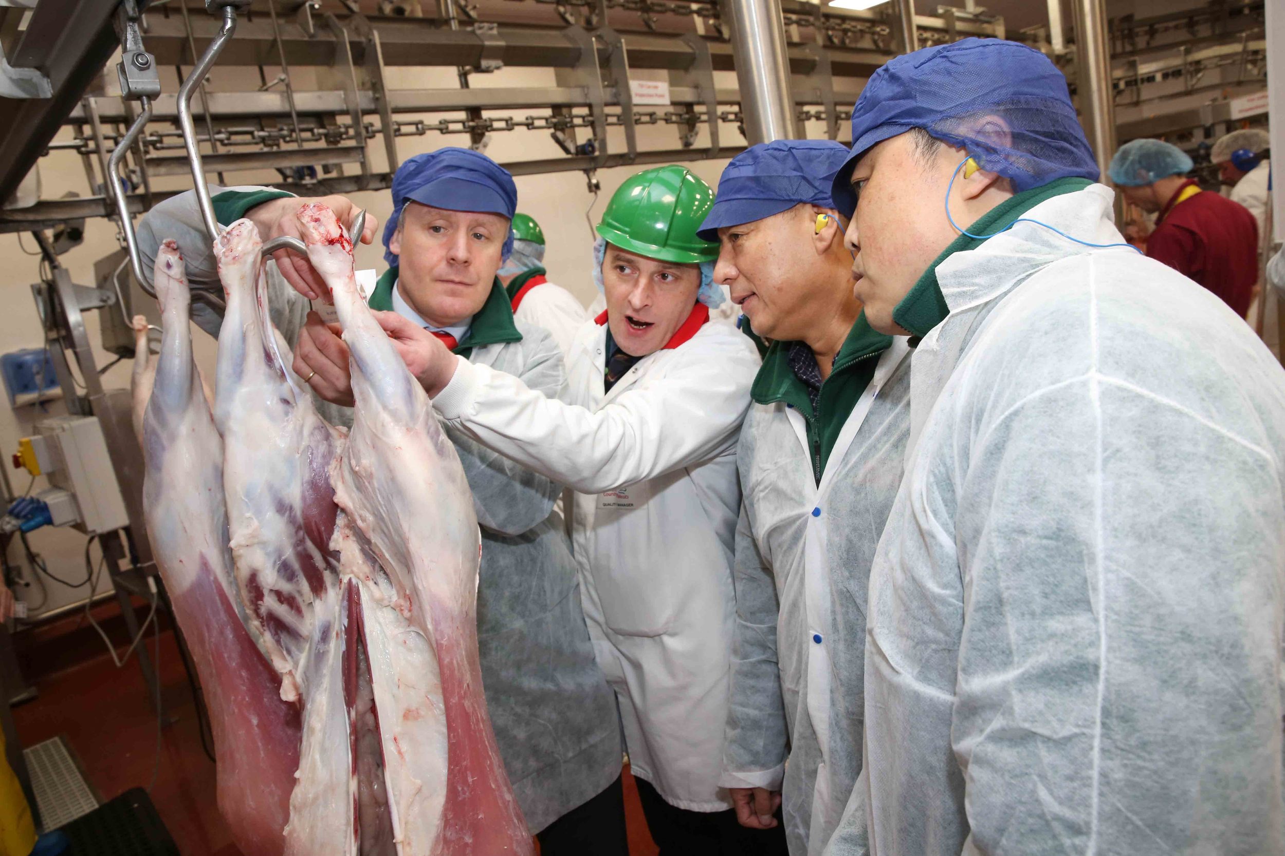  Irish Country Meats in Camolin Co Wexford. Declan farrell, from Bord Bia, Gerry McNally, Group Quality Manager Irish Country Meats, speaking with, Xibin Chen, Heilongjiang Grandfarm Group China, and Wei Chen, China Meat Association. Part of a Chines