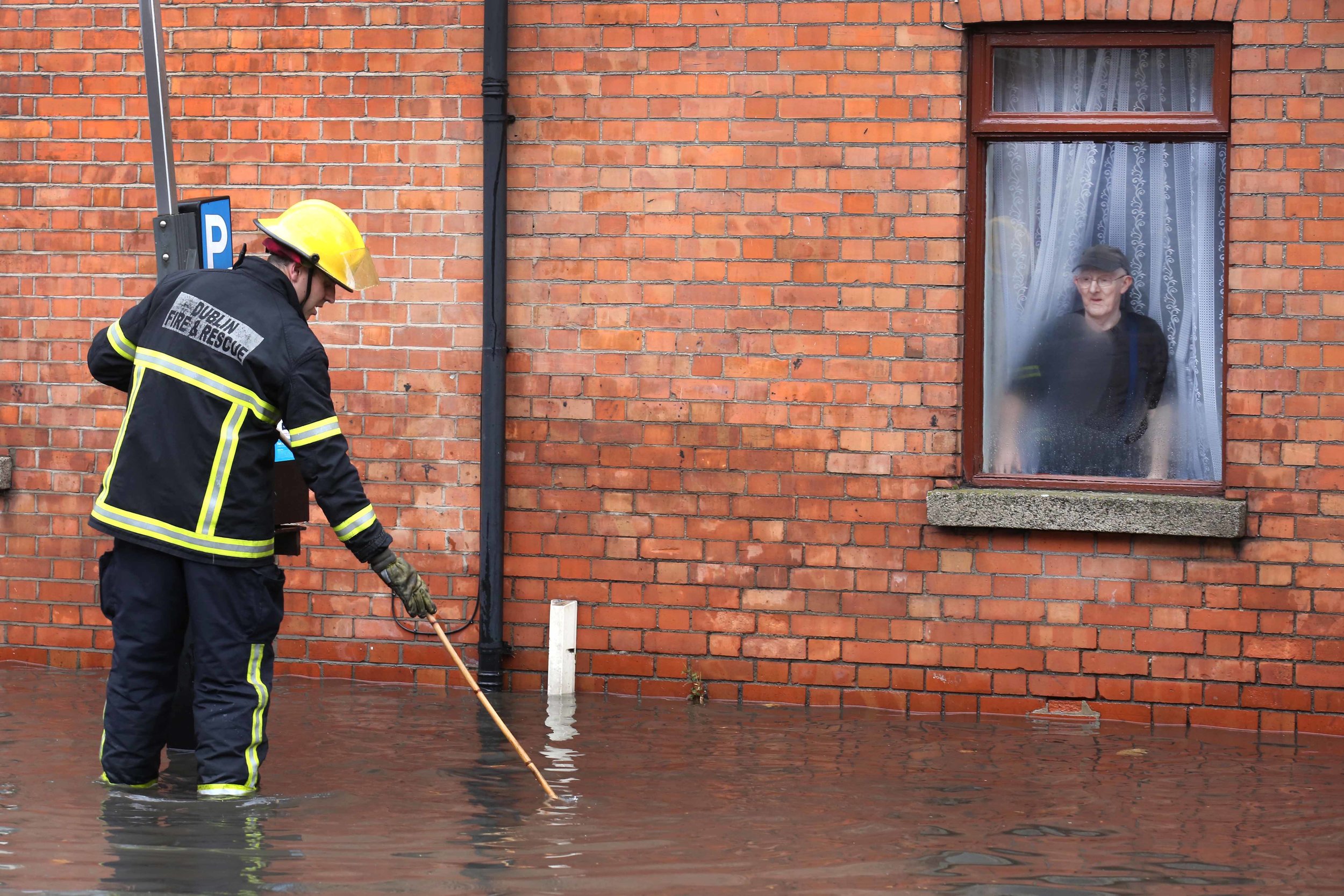  An elderly man is flooded into his home in Mount Brown Dublin 
