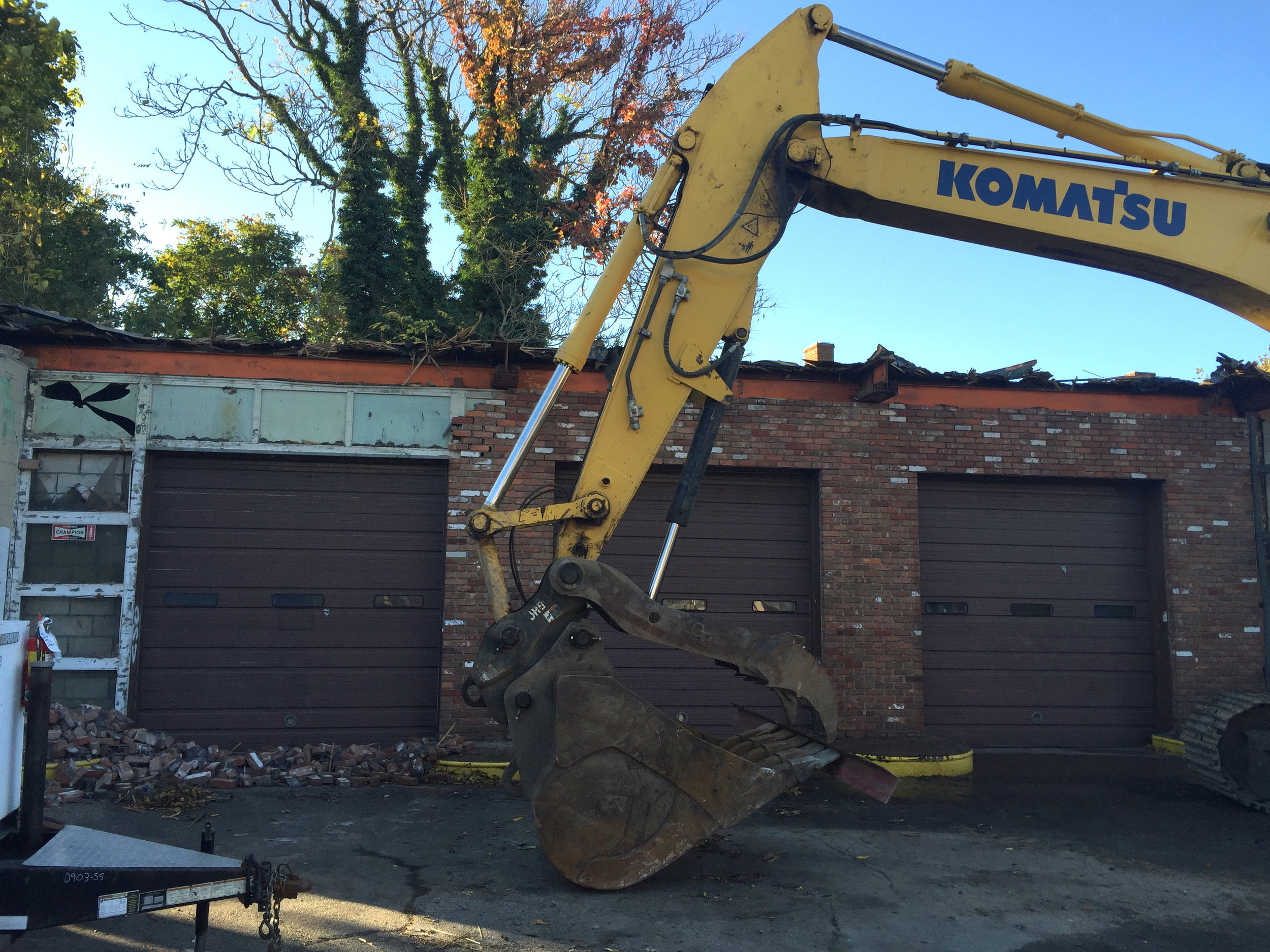  Removal of brick facade revealed original plate-glass and possible aluminum panel framing 