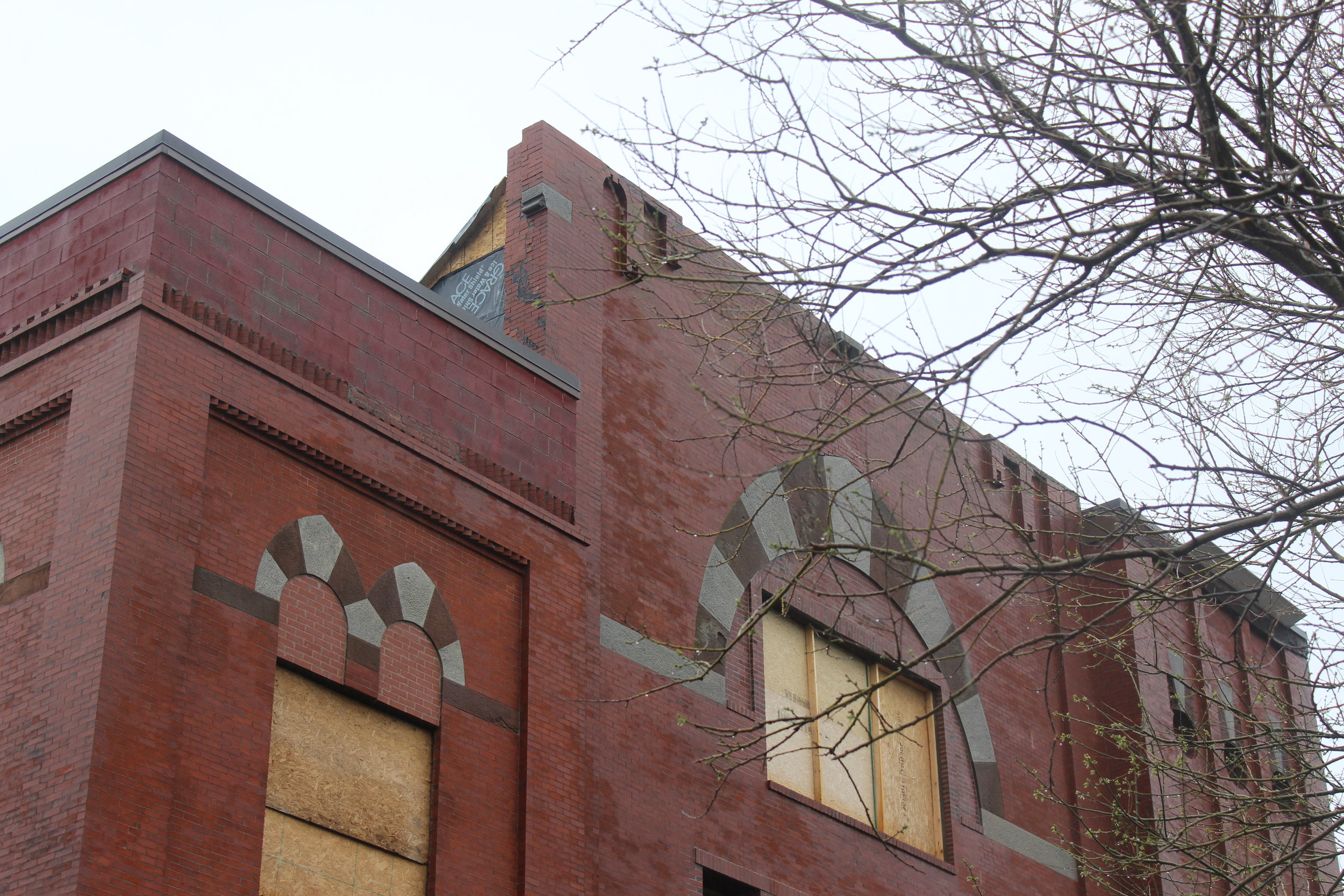  Facade above what used to be the rose window stood for years without any supports – Manaigo created a slanted roof to re-attach the facade to the building 