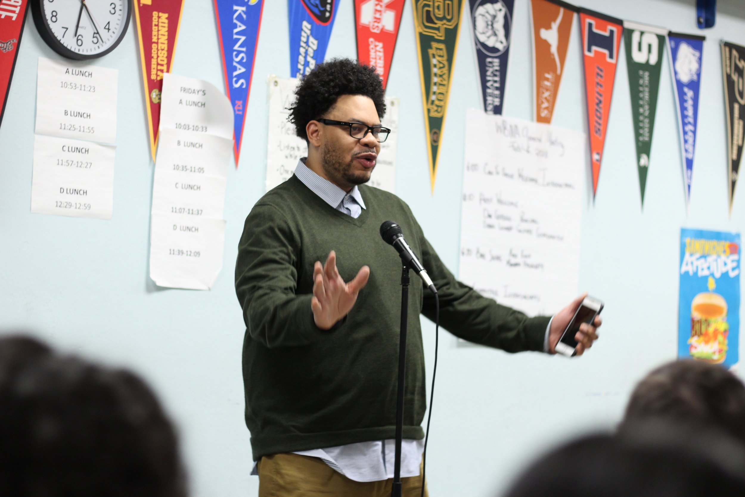  Erroll Lomba,&nbsp;culture coordinator from West Broadway Middle School, welcomes neighbors to his school 